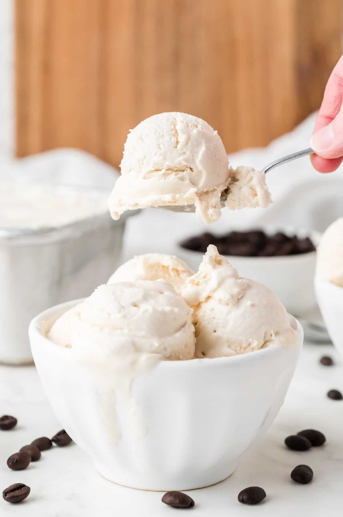 coffee ice cream in a bowl being scooped out