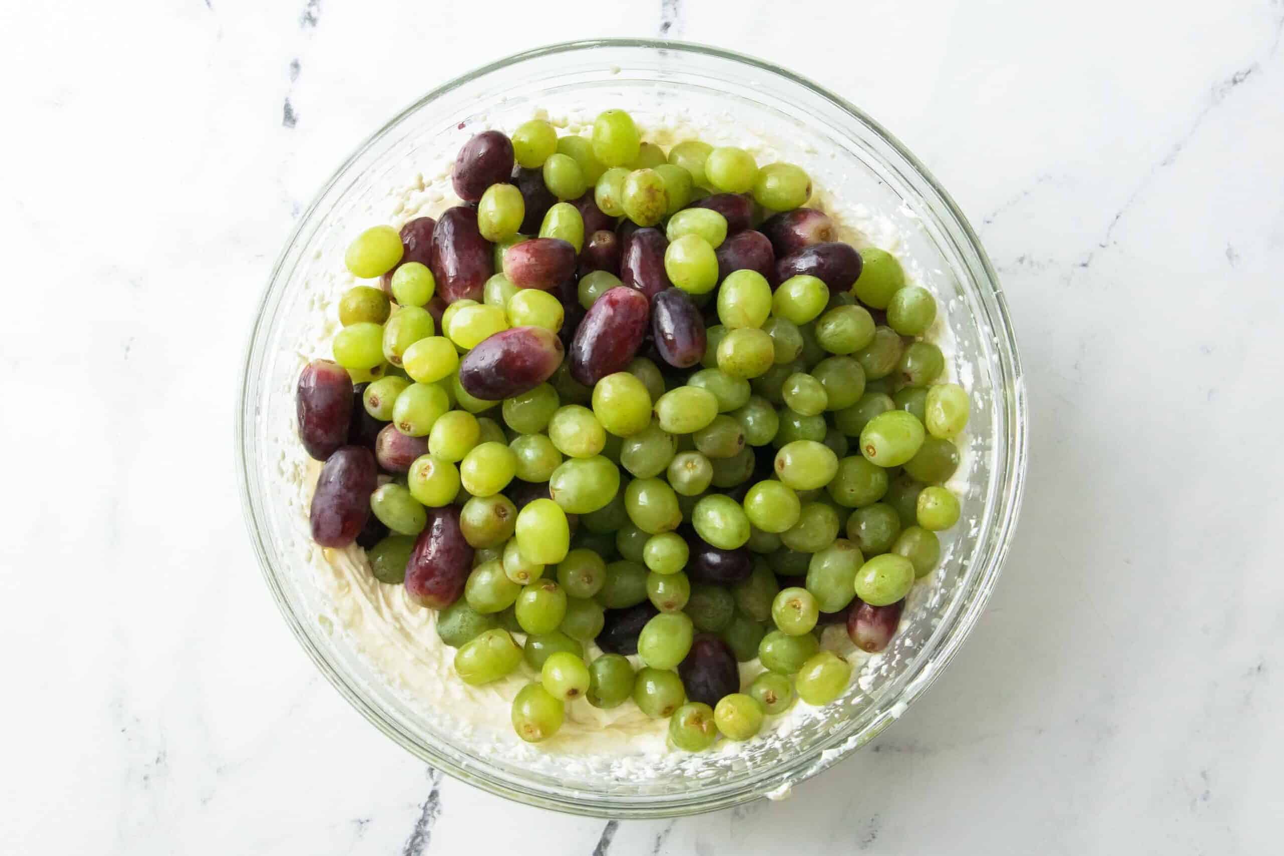 grapes on top of creamy dressing