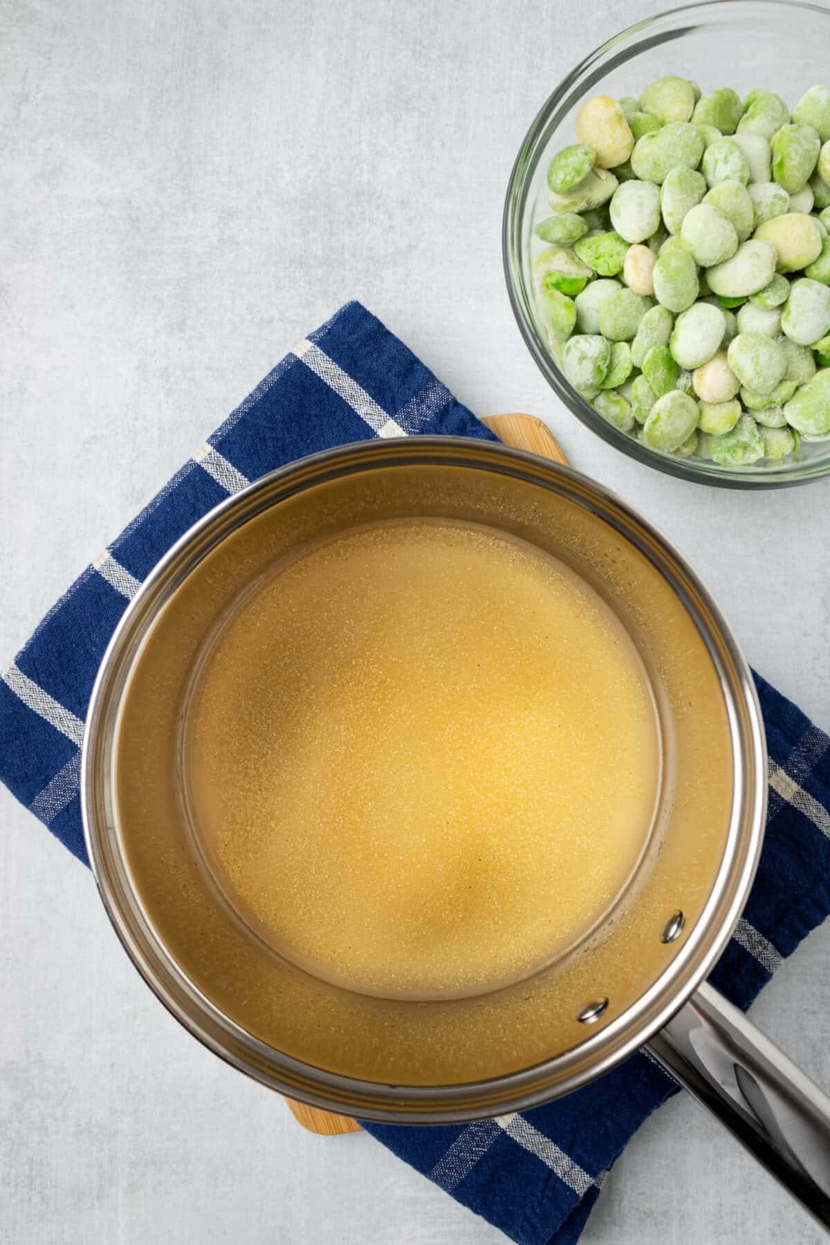 pot of chicken stock with seasoning