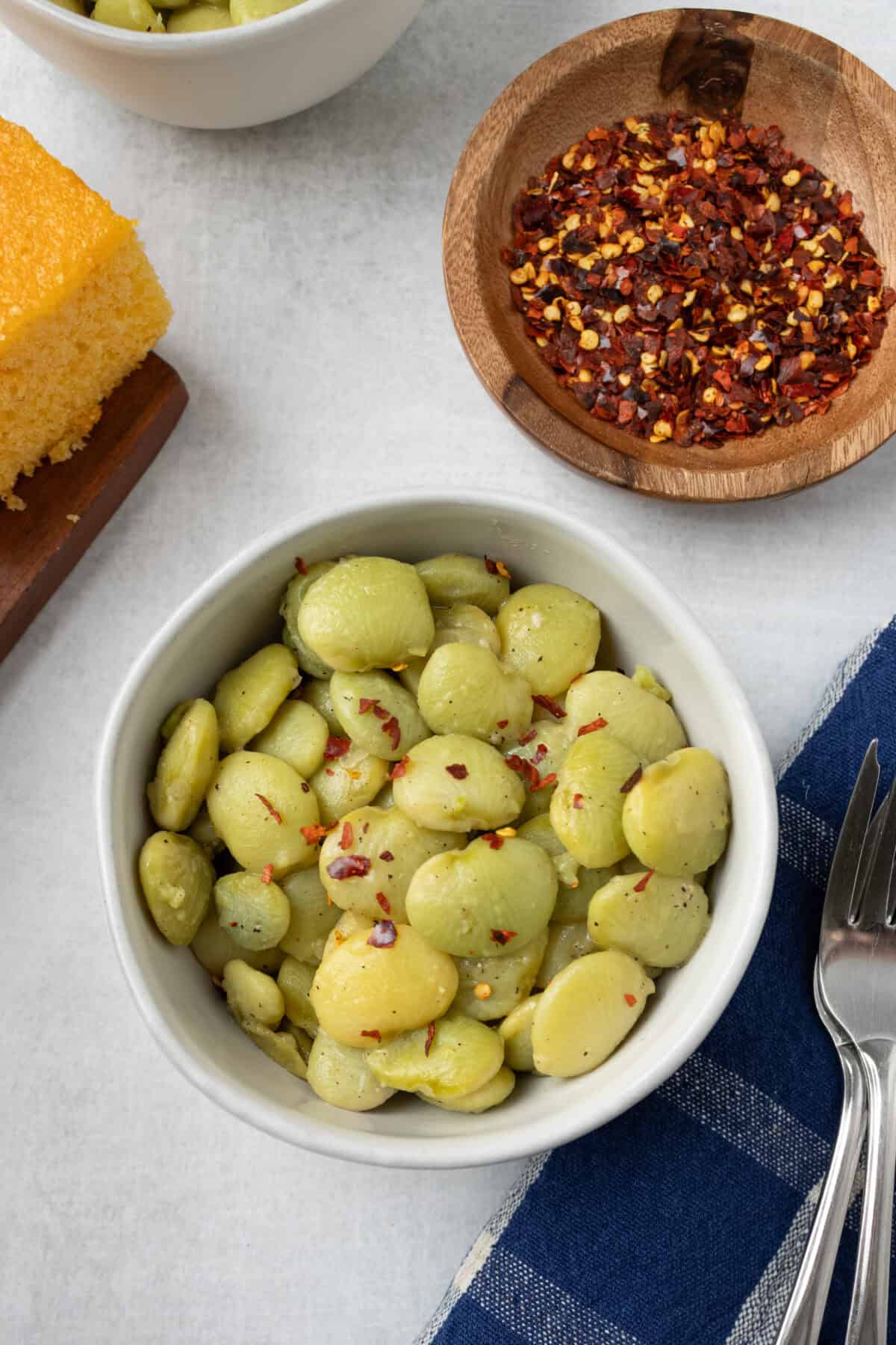 bowl of butter beans with red pepper flakes