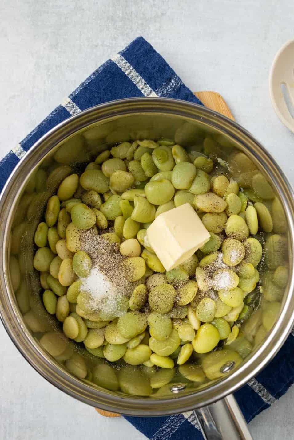 sugar and butter and other seasonings added to cooked butter beans