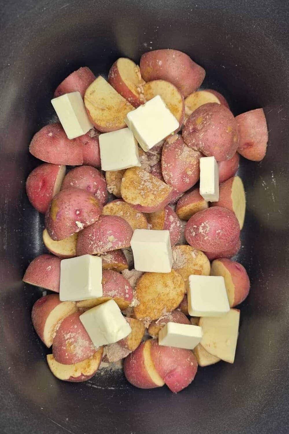 red potatoes with seasoned salt and butter on top
