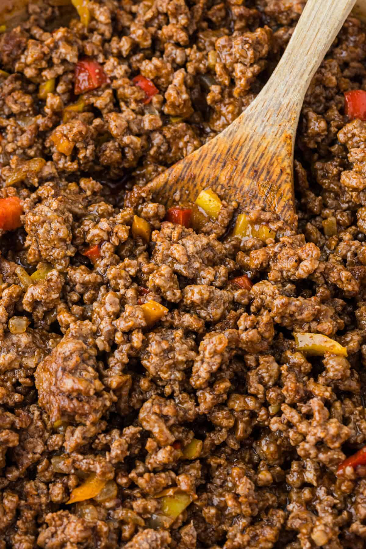 taco meat with a wooden spoon