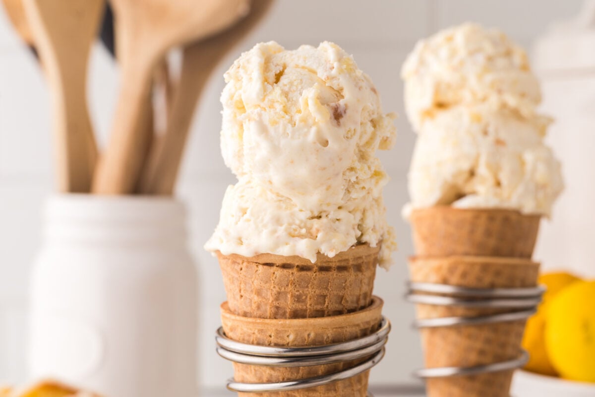 scoops of lemon ice cream on a waffle cone