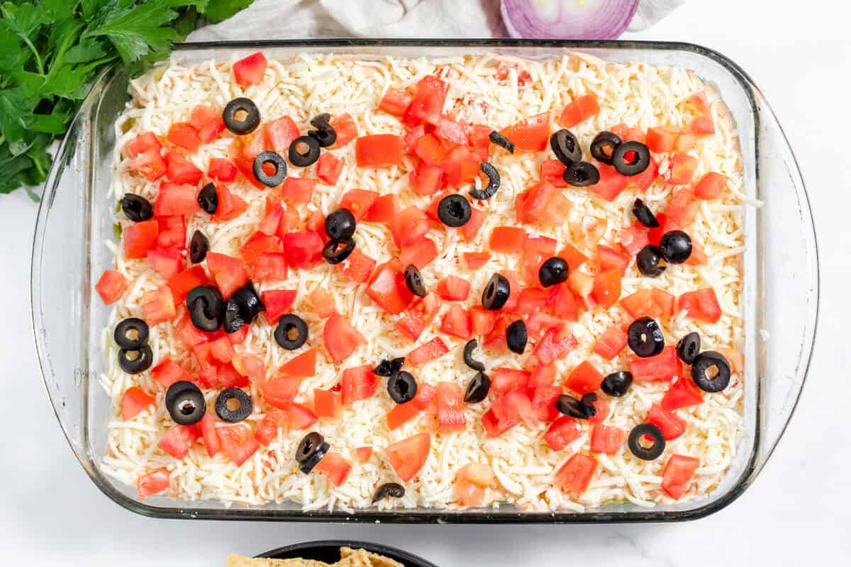 7 layer taco dip in a 9x13 dish