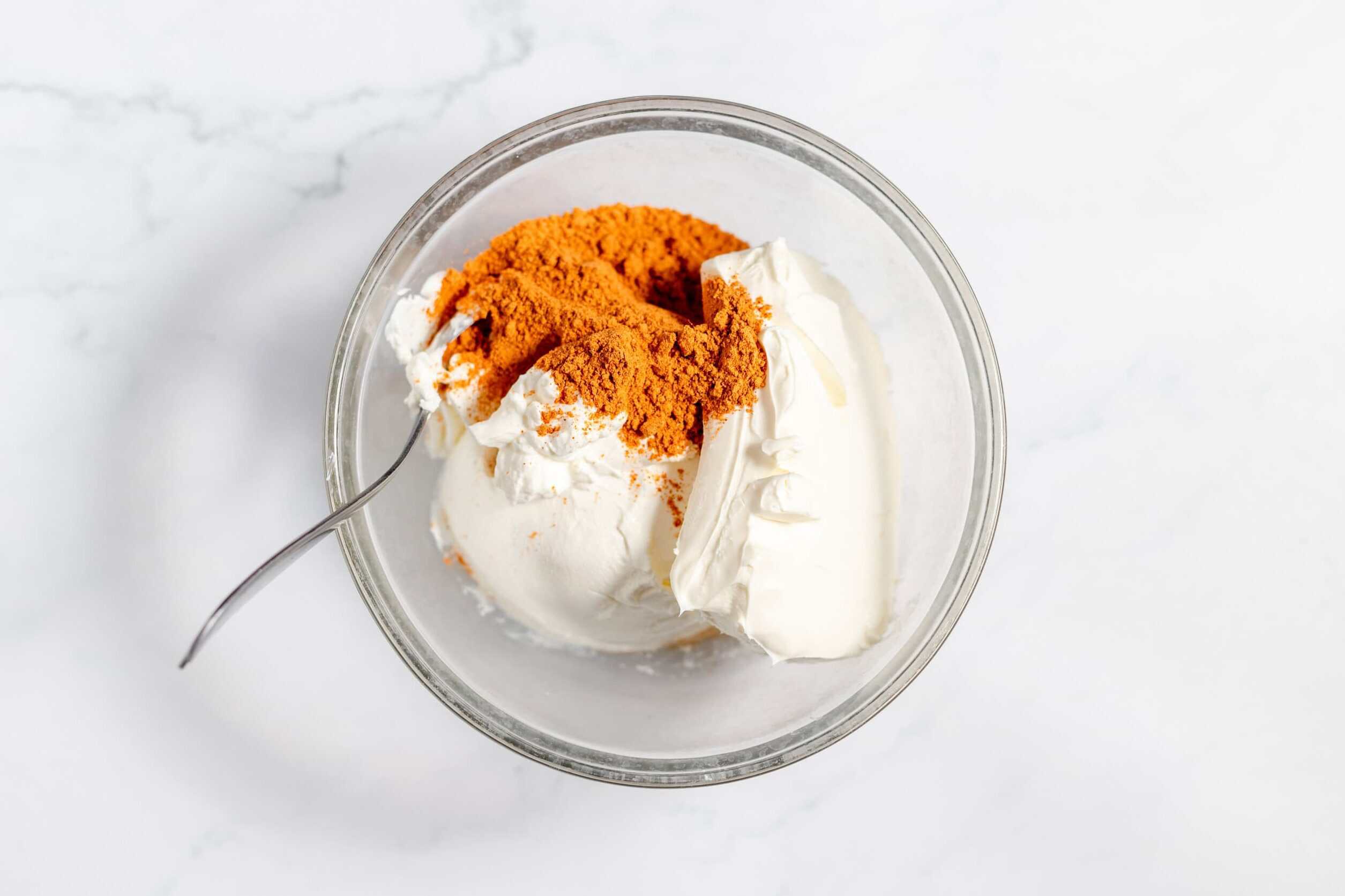sour cream, cream cheese, and taco seasoning in a bowl