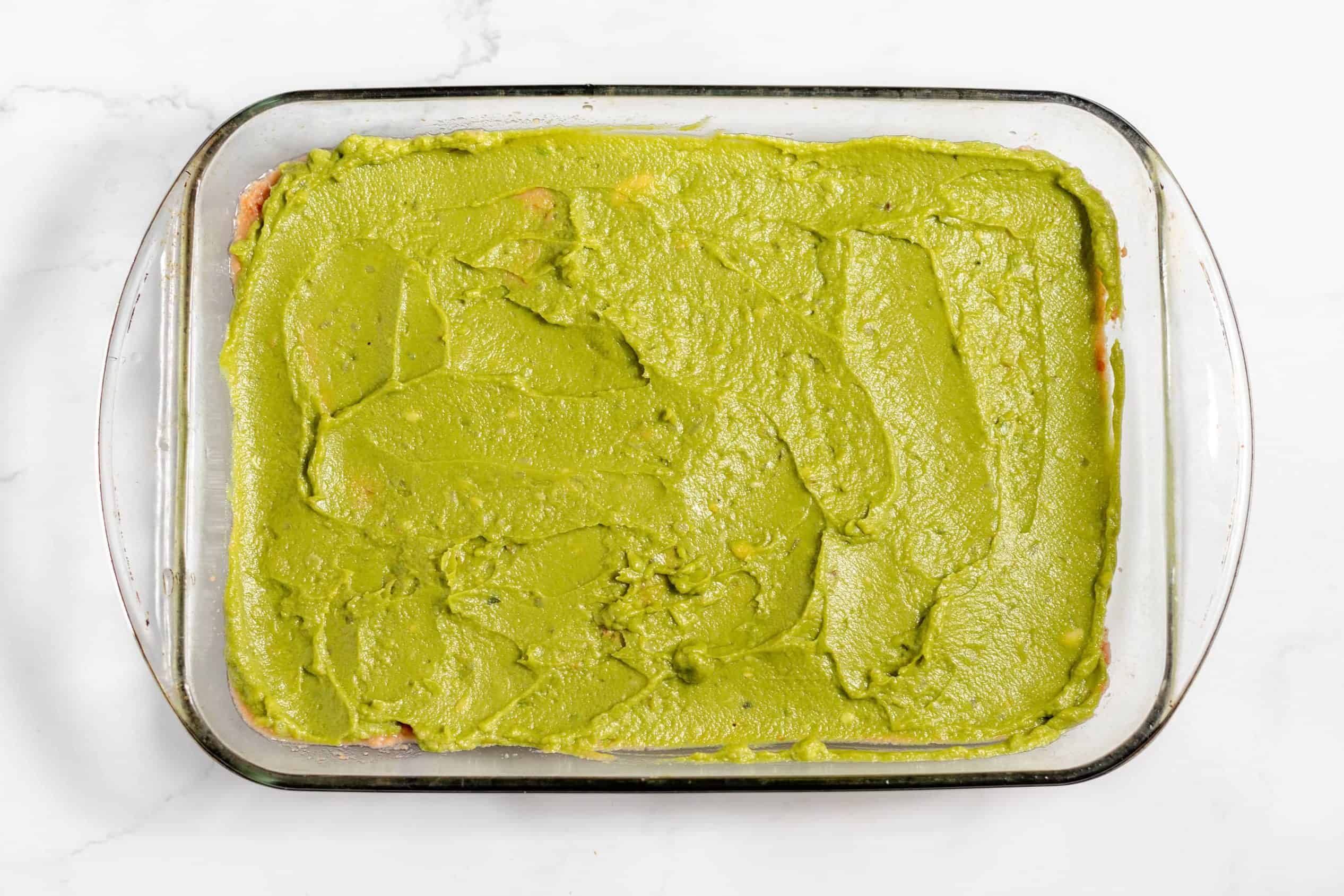 guacamole over refried beans