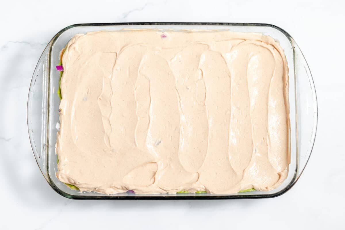 sour cream - cream cheese mixture spread over onions