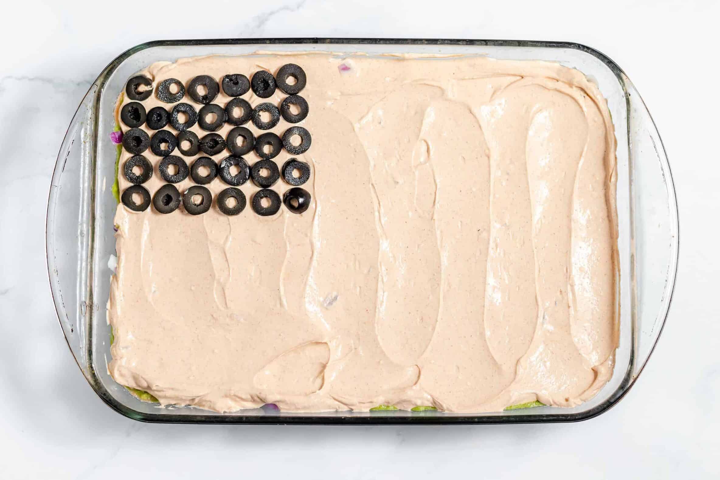 sliced black olives in top left corner for stars and stripes