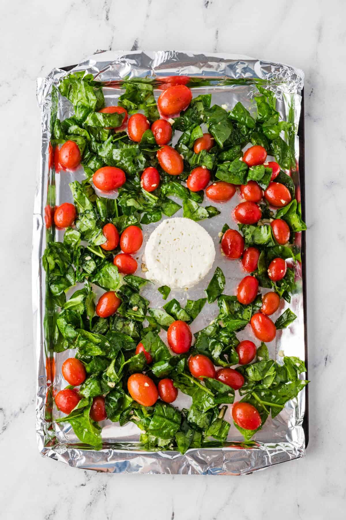 vegetables and cheese on a sheet pan