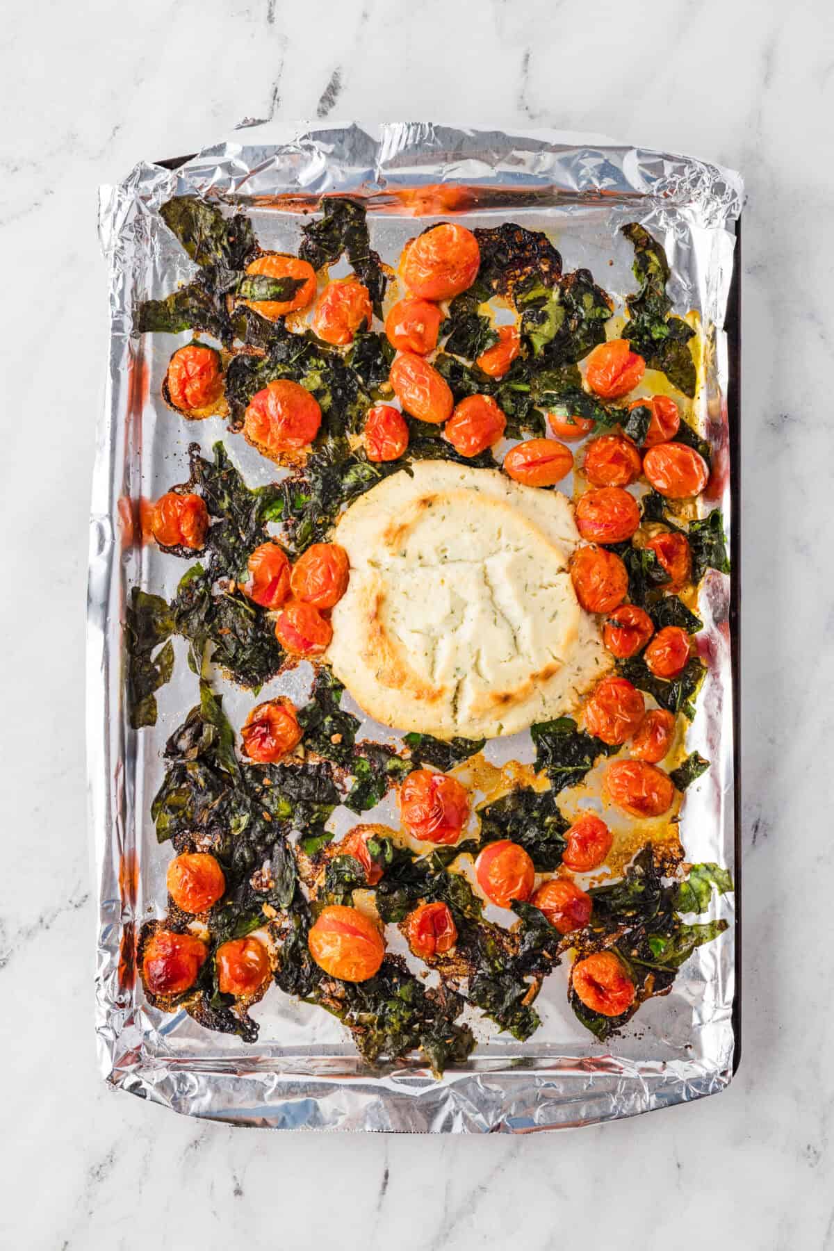 roasted vegetables and melted Boursin on a sheet pan