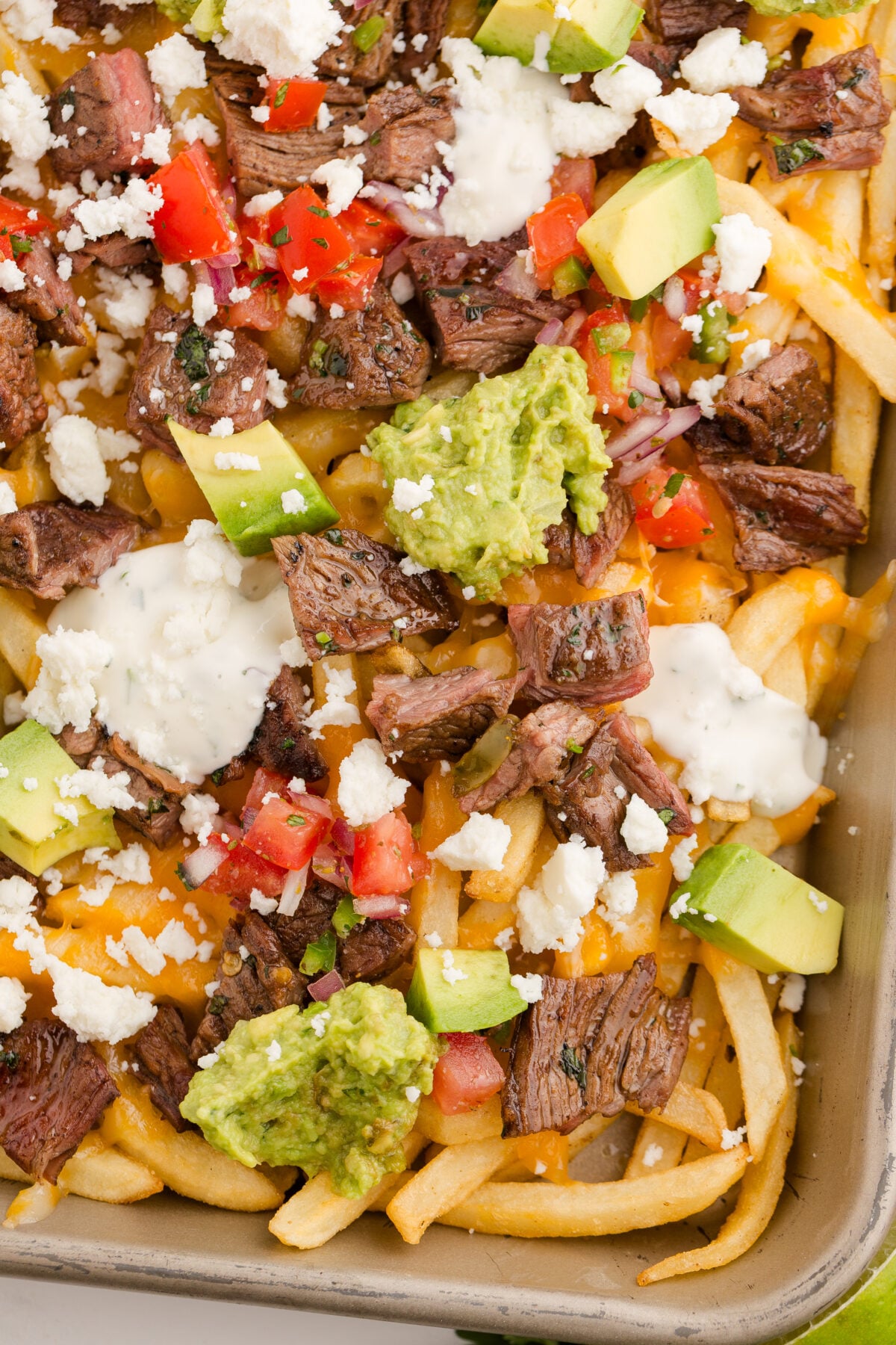 carne asada fries with pico de gallo and guacamole