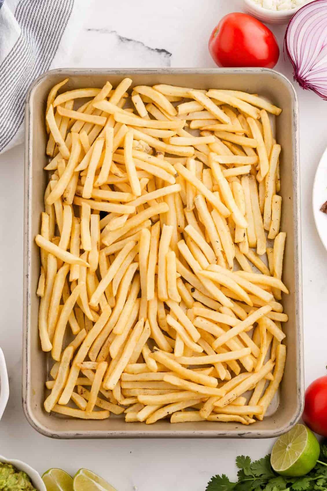 frozen fries on a baking sheet