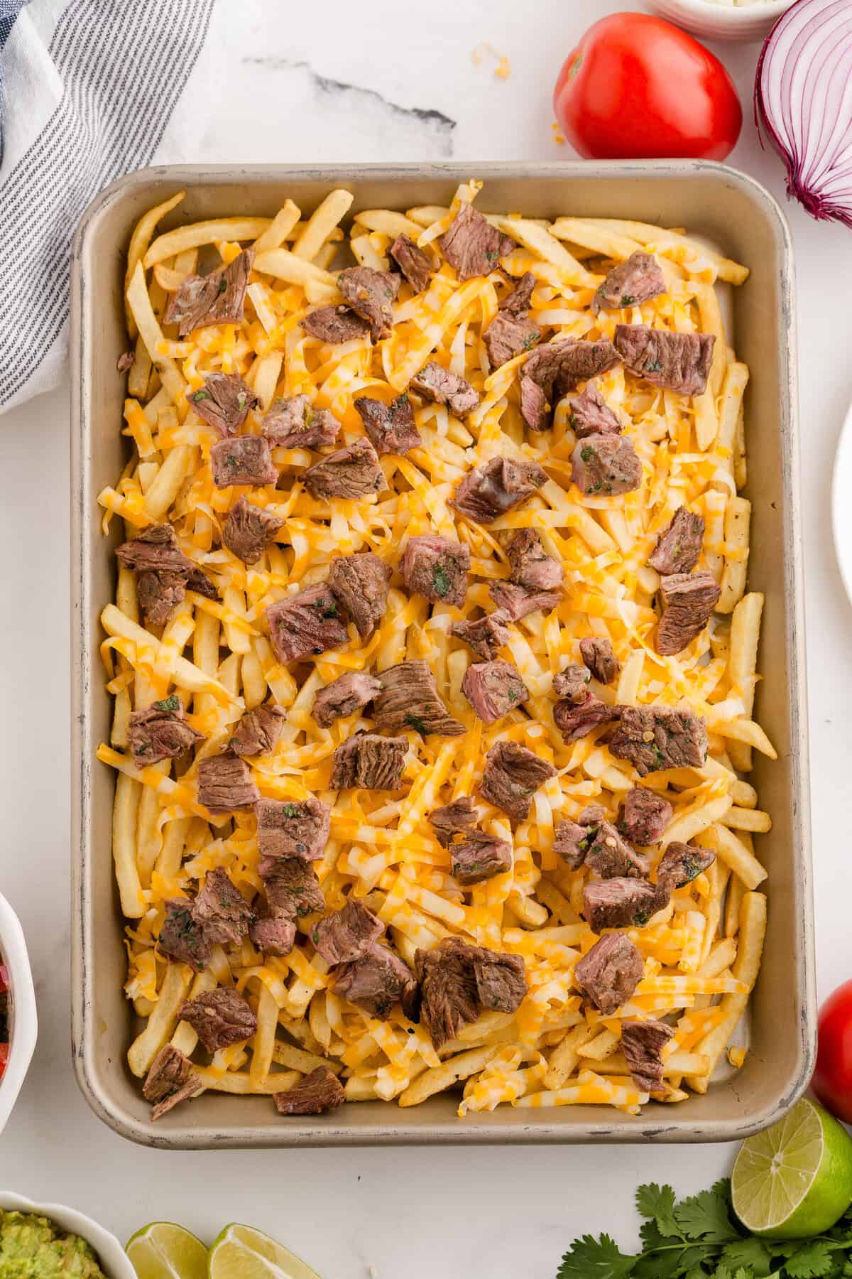 carne asada meat over cheese and fries