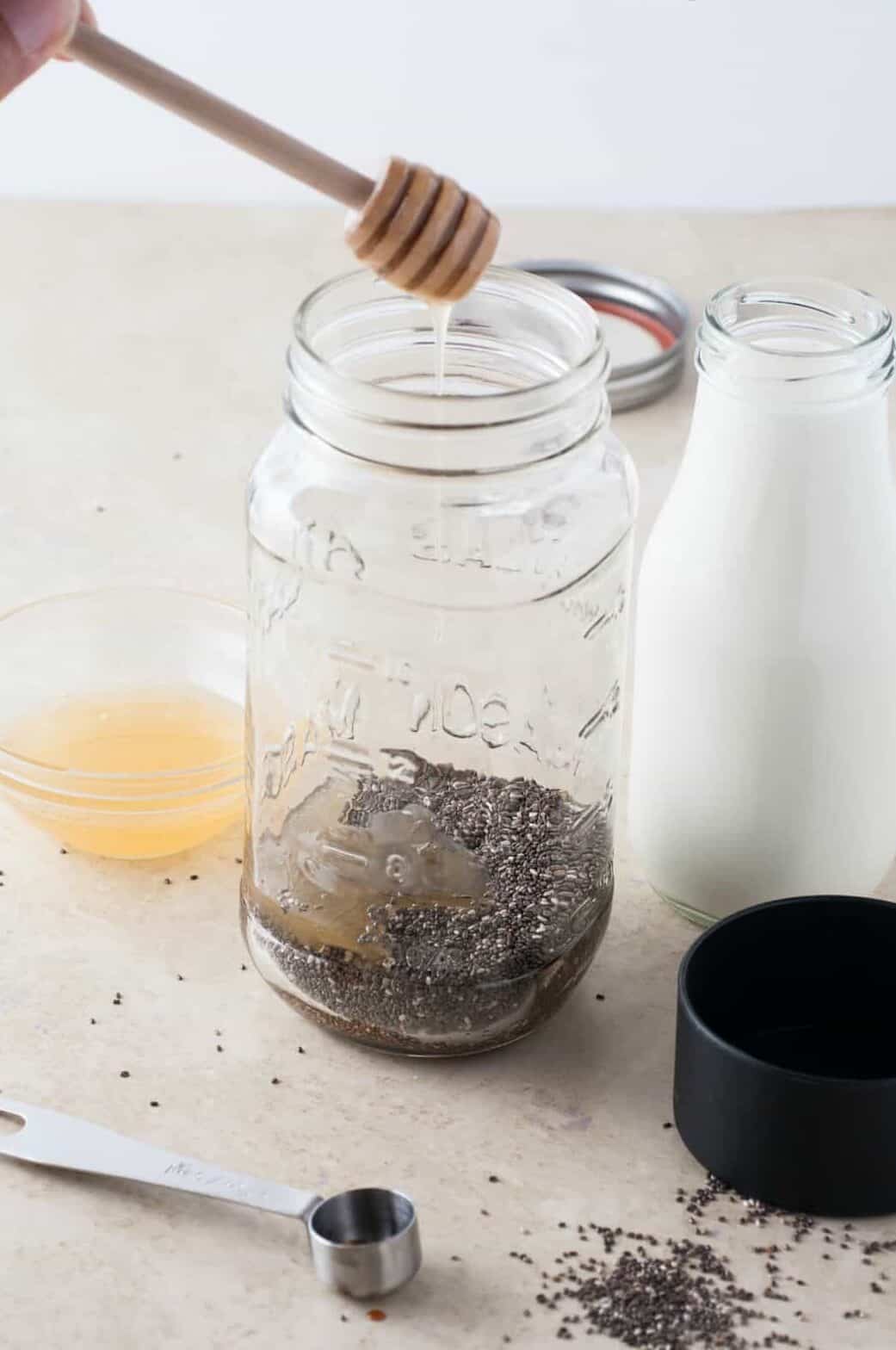 adding honey to jar of chia seeds and honey