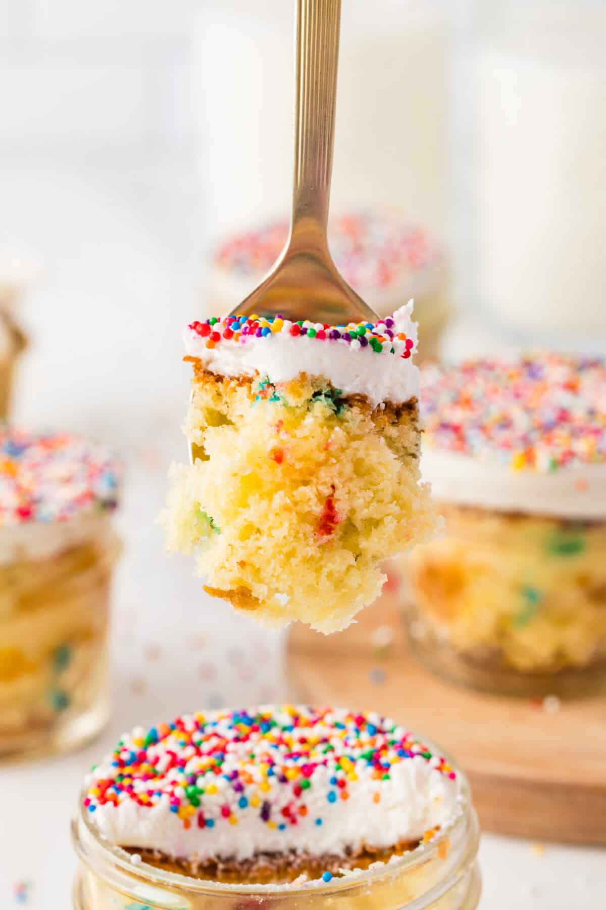 bite of dot cake on a fork above a jar