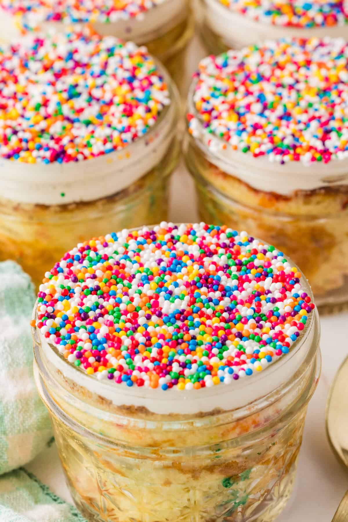 dot cakes covered in rainbow sprinkles