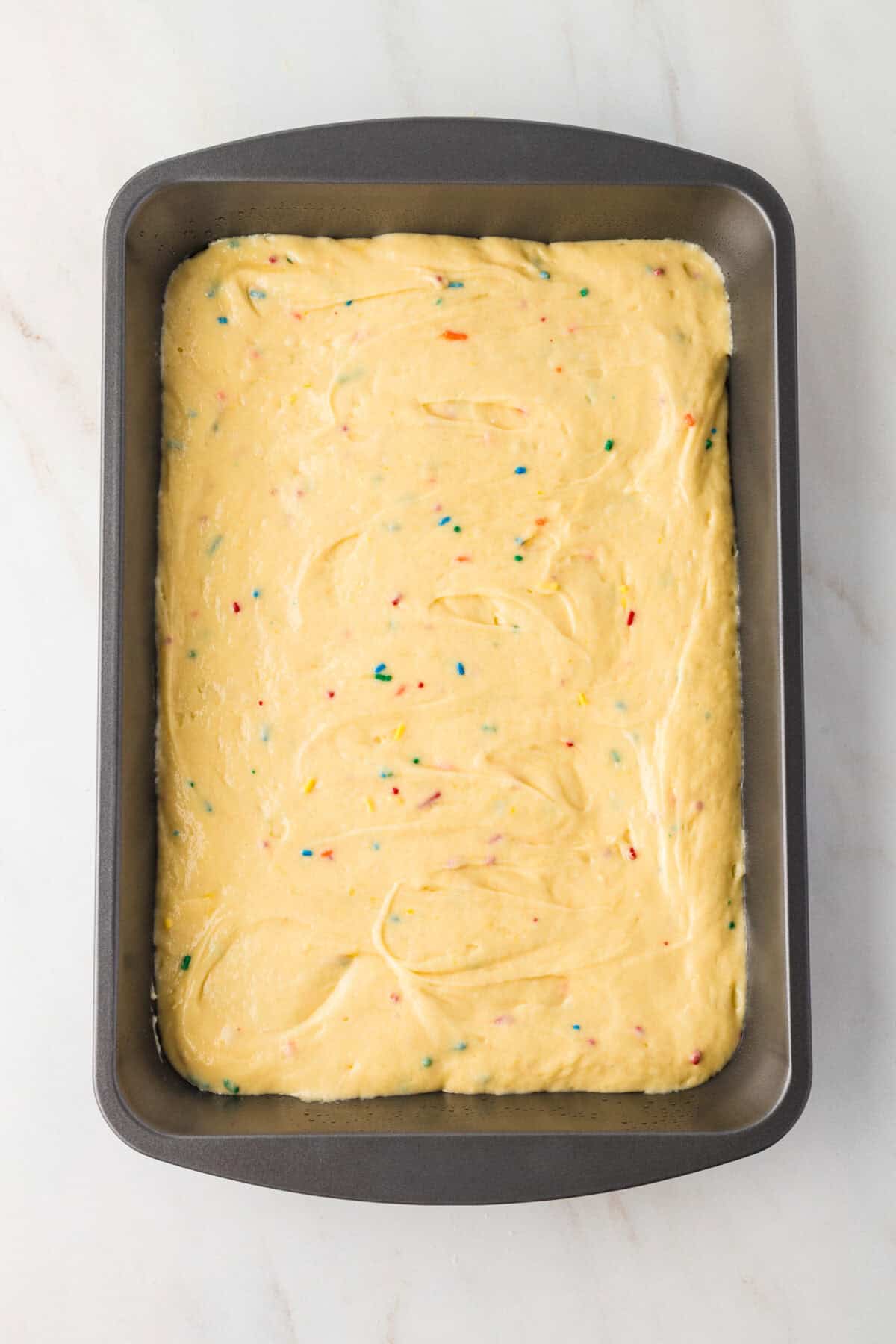 cake batter spread in pan