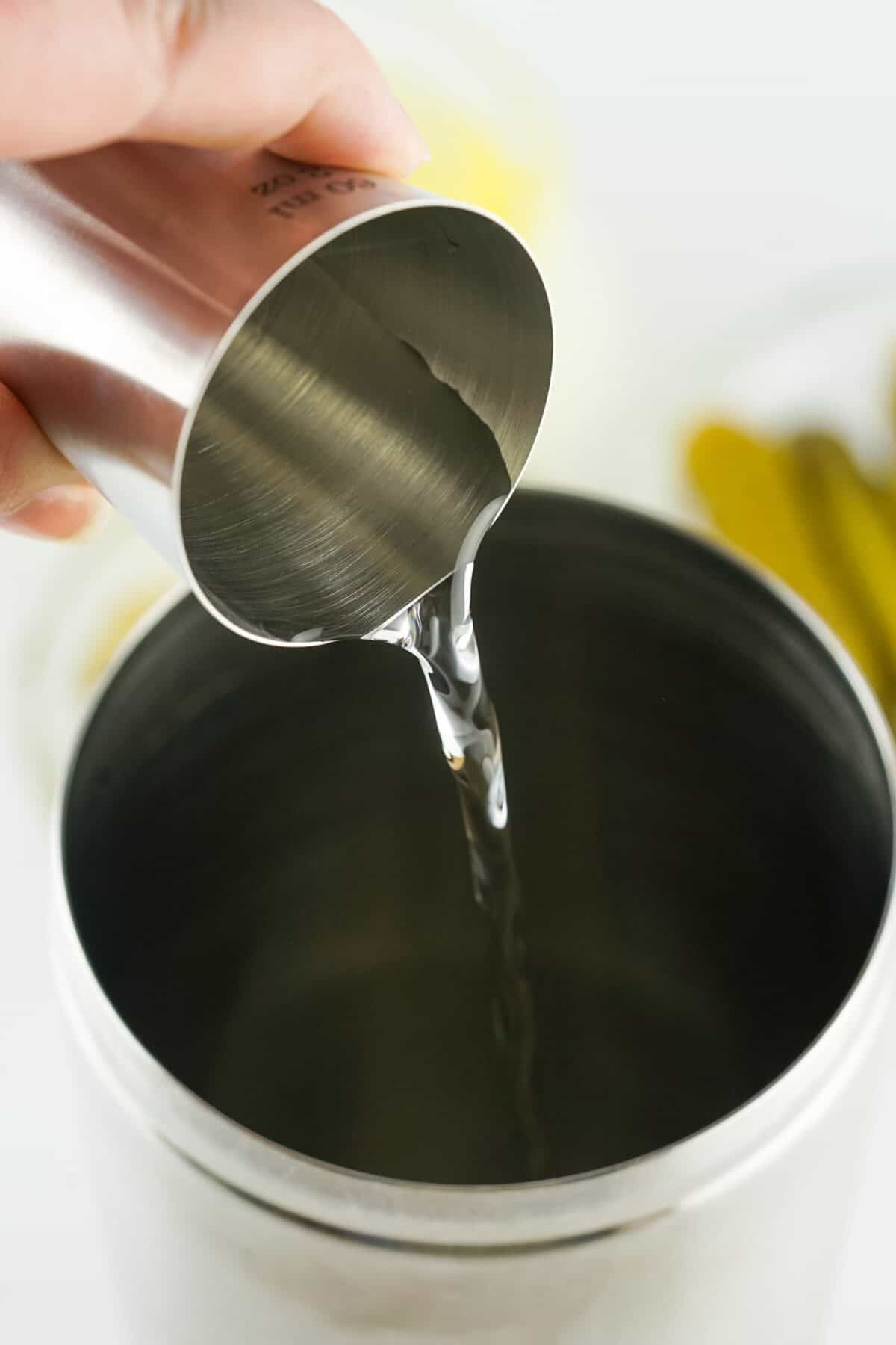 pouring vodka into shaker