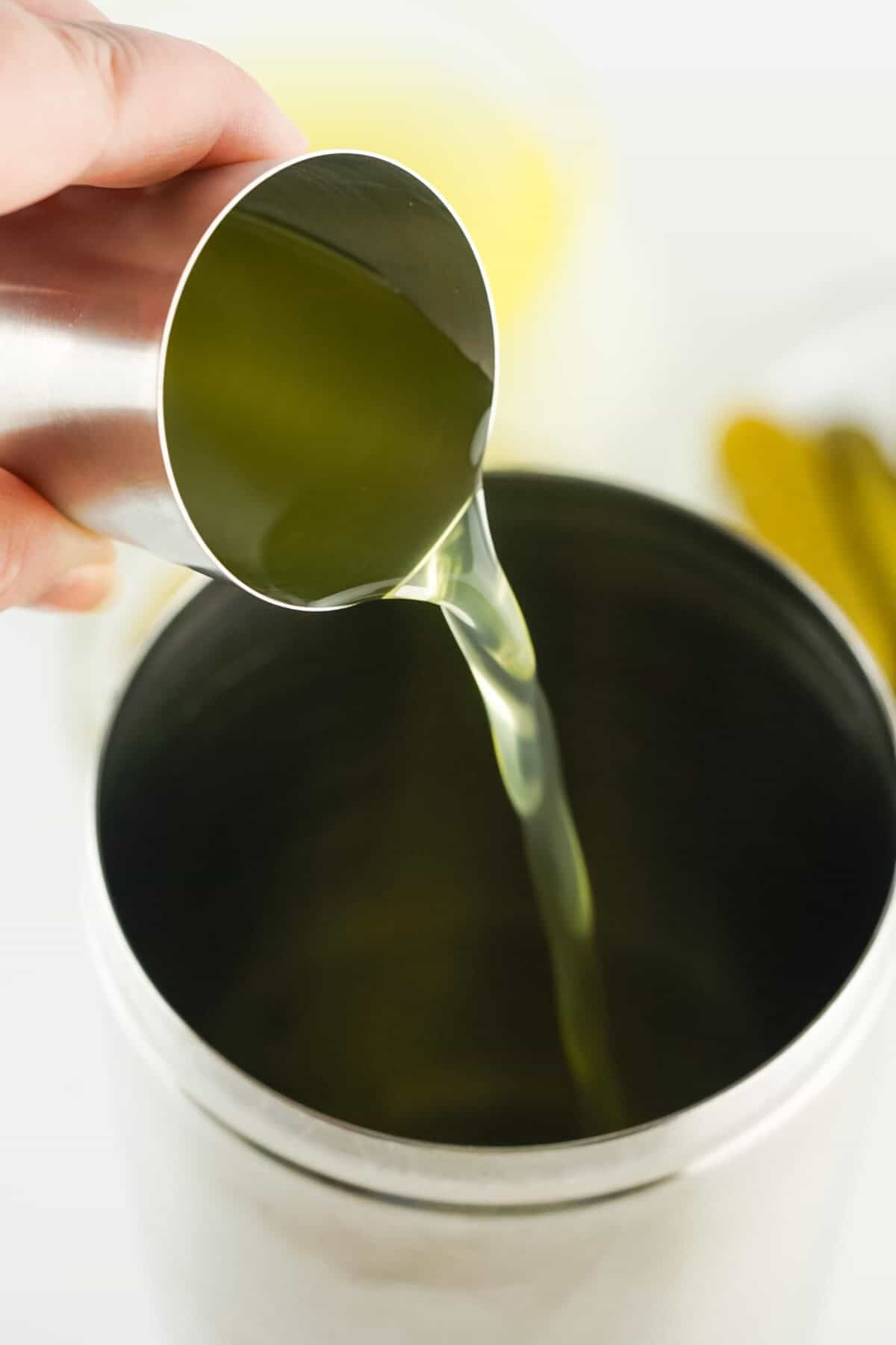 pouring pickle juice in shaker