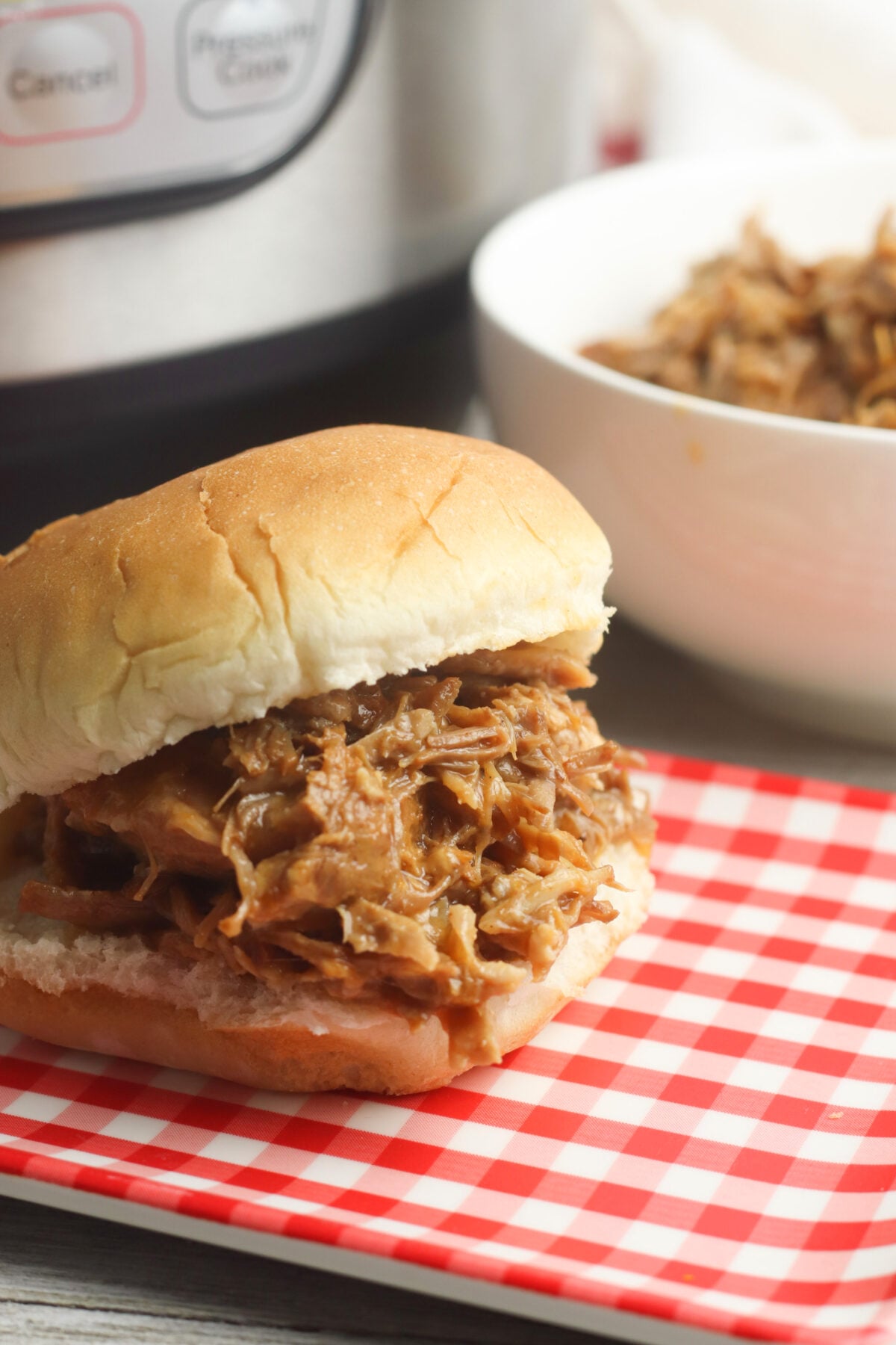 instant pot pulled pork on a bun for a sandwich