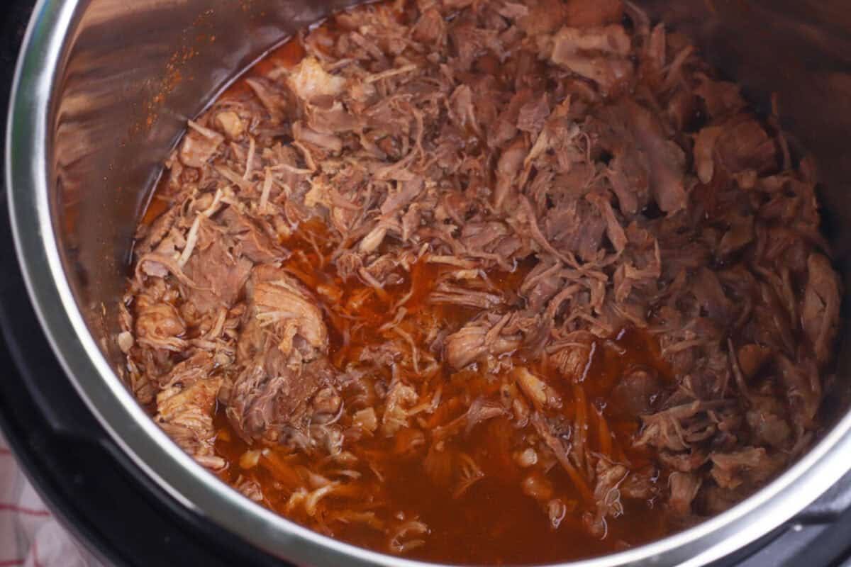 shredded pulled pork in instant pot with sauce