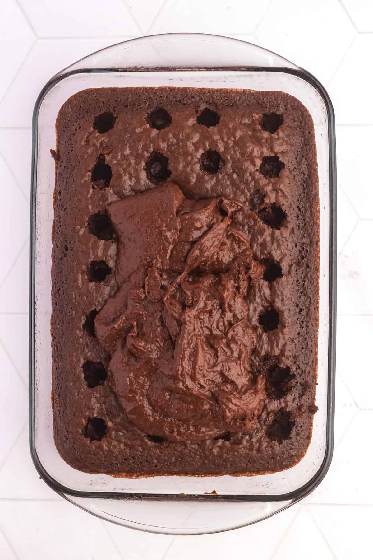 pudding on top of cake with holes poked in it