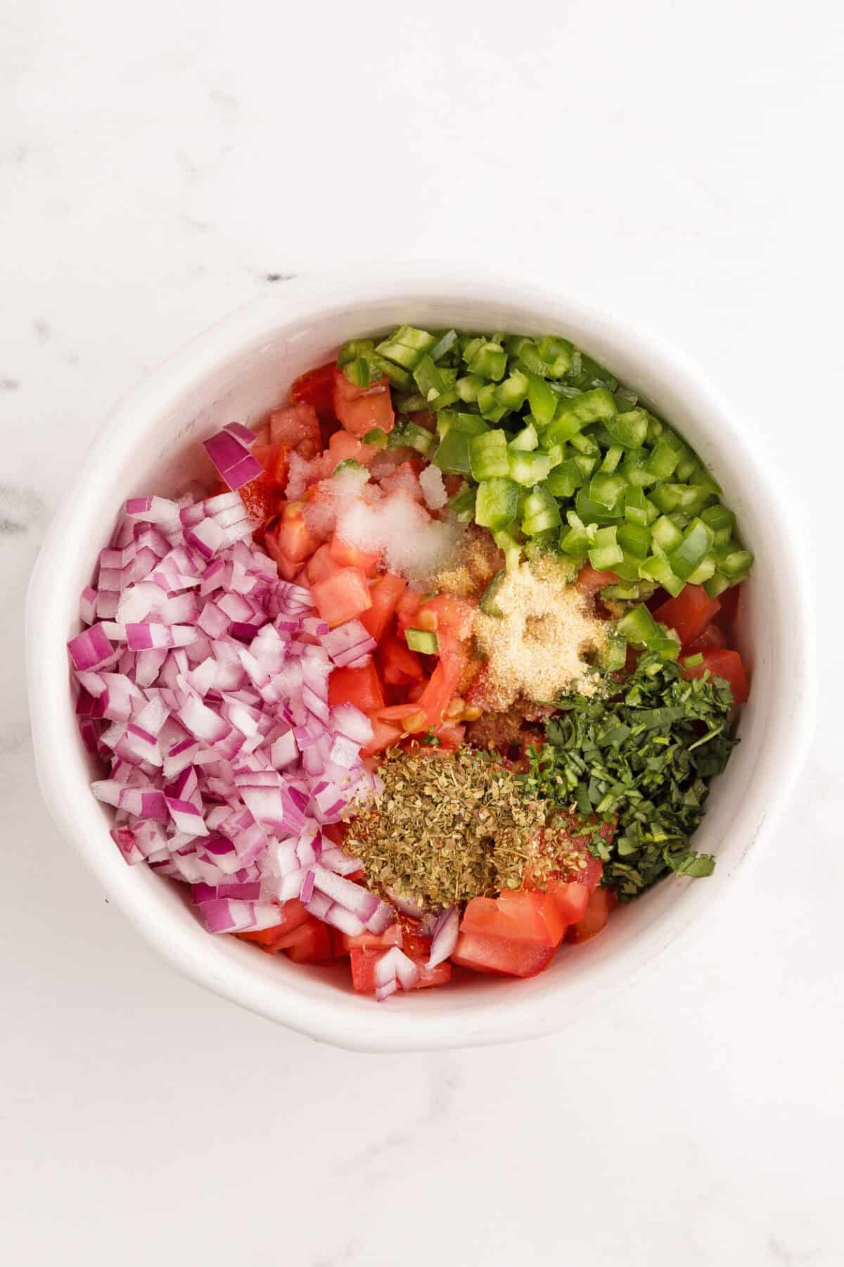 ingredients for pico de gallo diced in a bowl