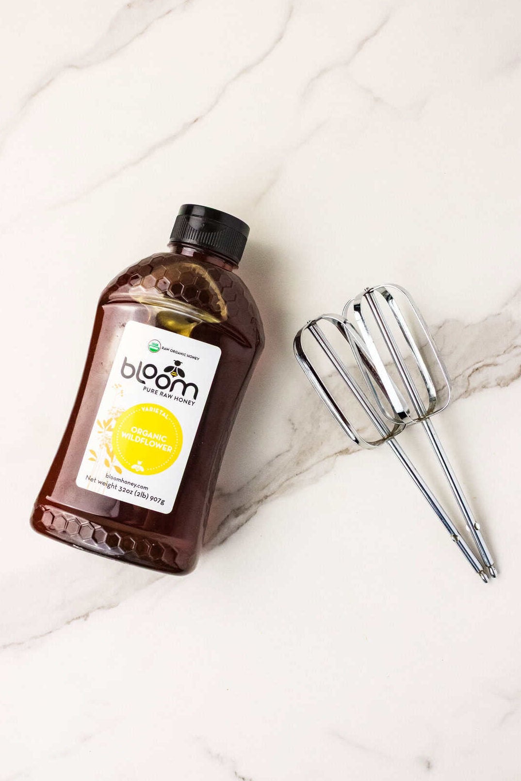 bottle of honey and beater blades