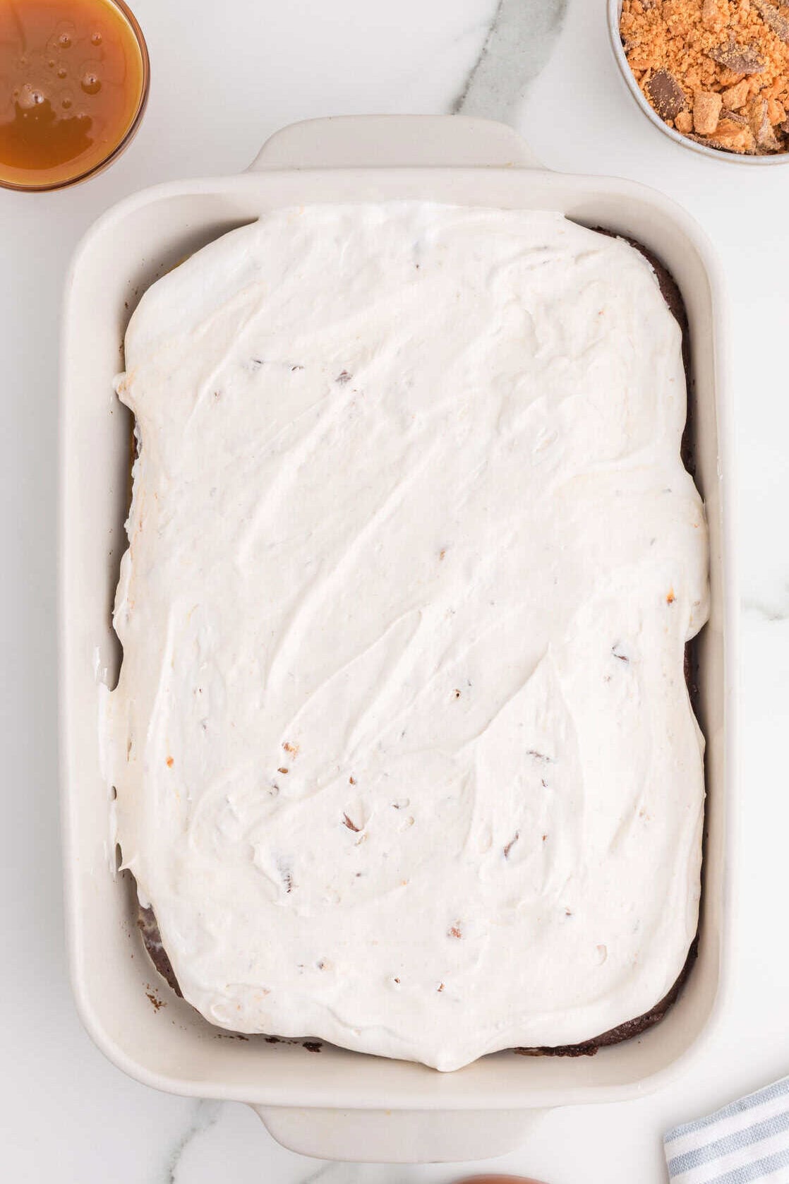 chopped butterfinger mixed into whipped cream and spread over chocolate cake
