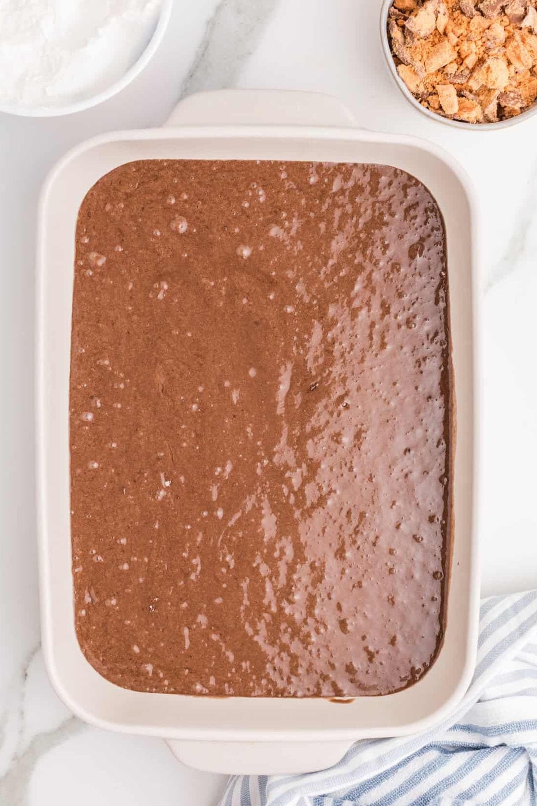 mixed up cake batter in 9x13 baking dish