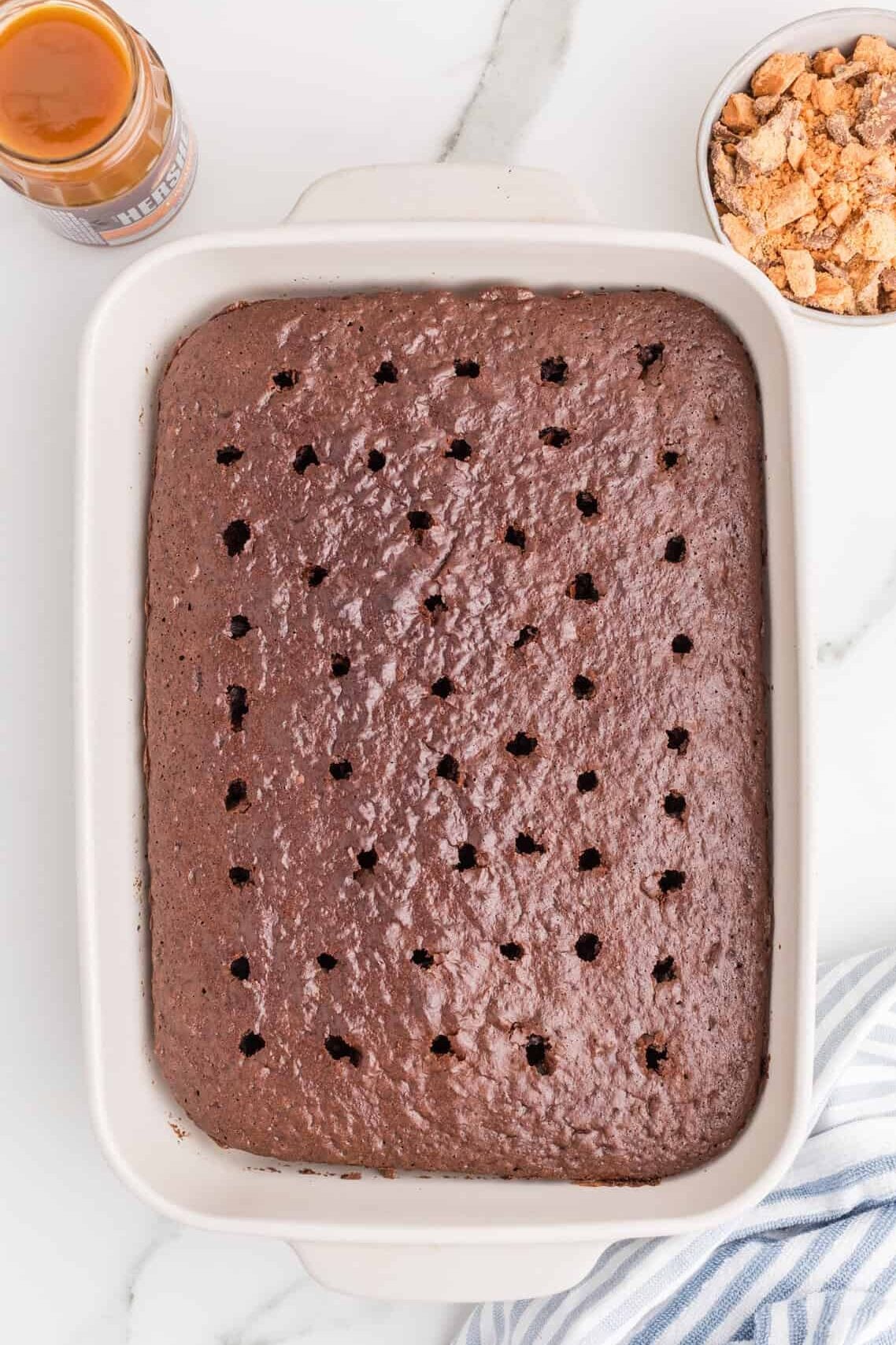 chocolate cake with holes poked in it