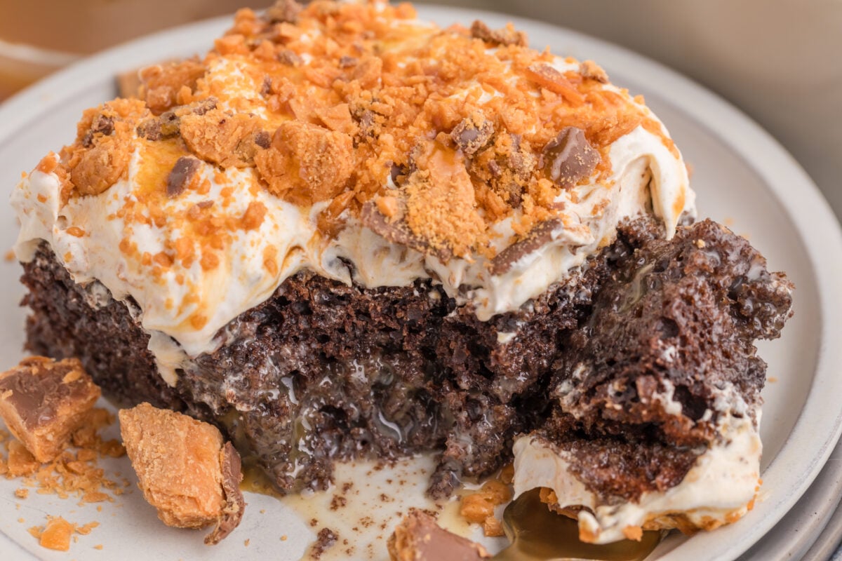 butterfinger poke cake with a bite out of it