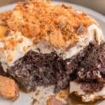 butterfinger poke cake with a bite out of it