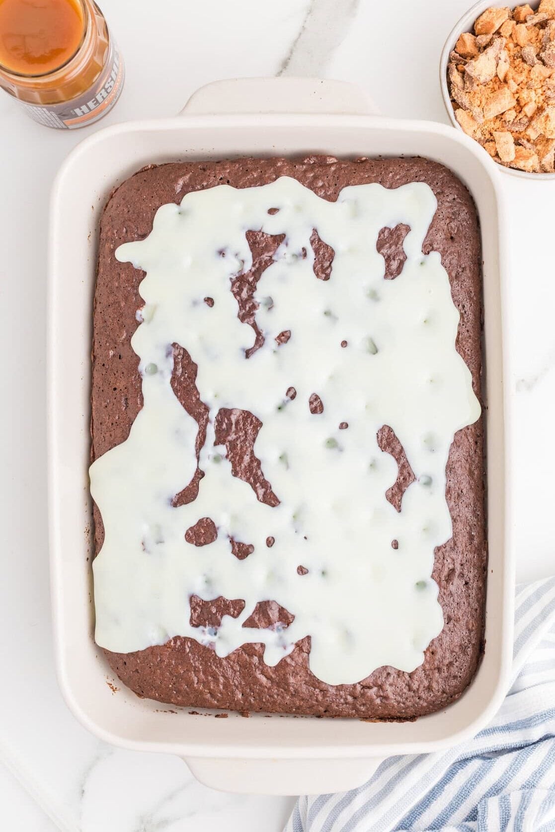 condensed milk pored over chocolate cake