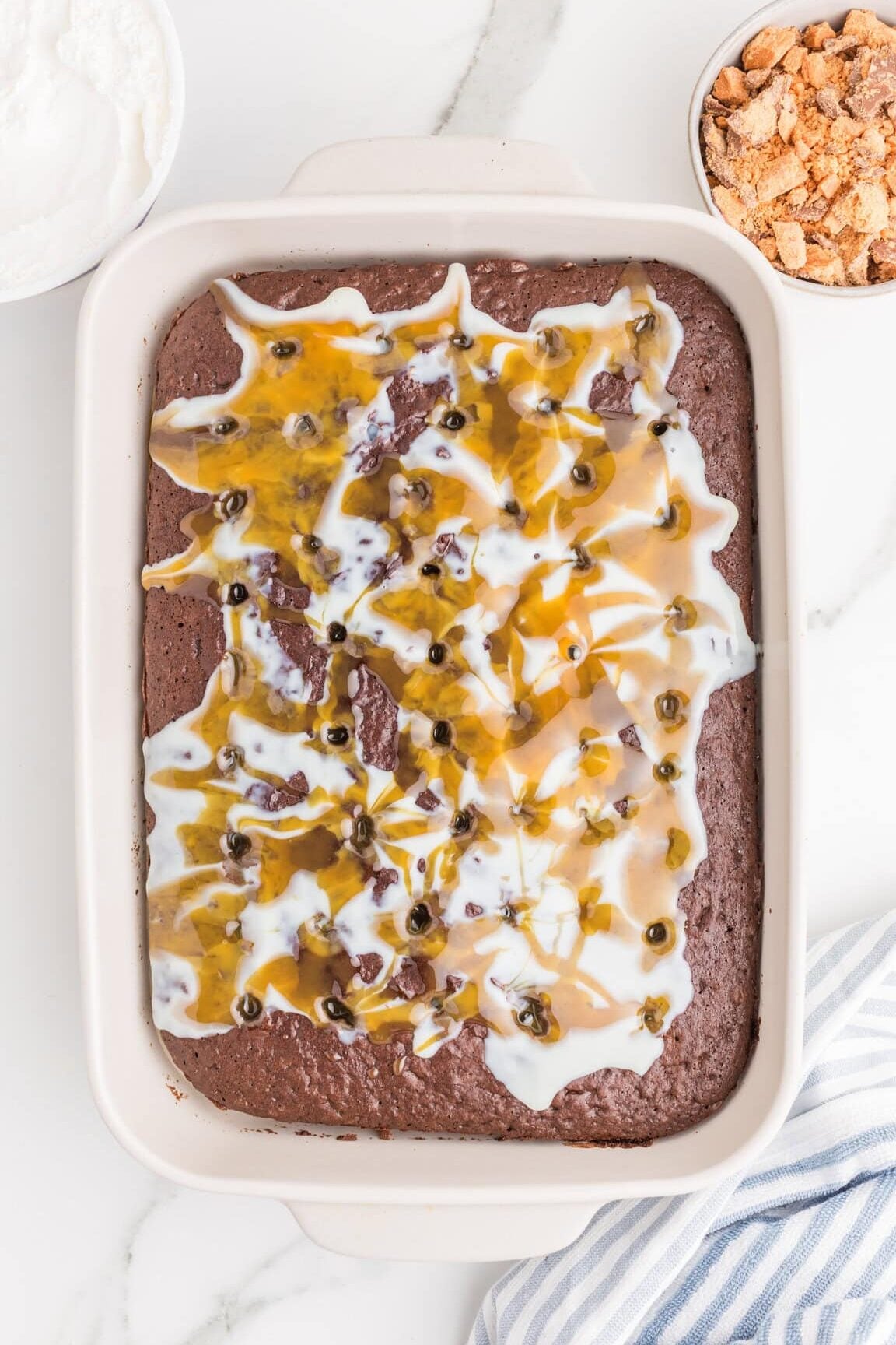 butterscotch sauce and condensed milk pored over chocolate cake