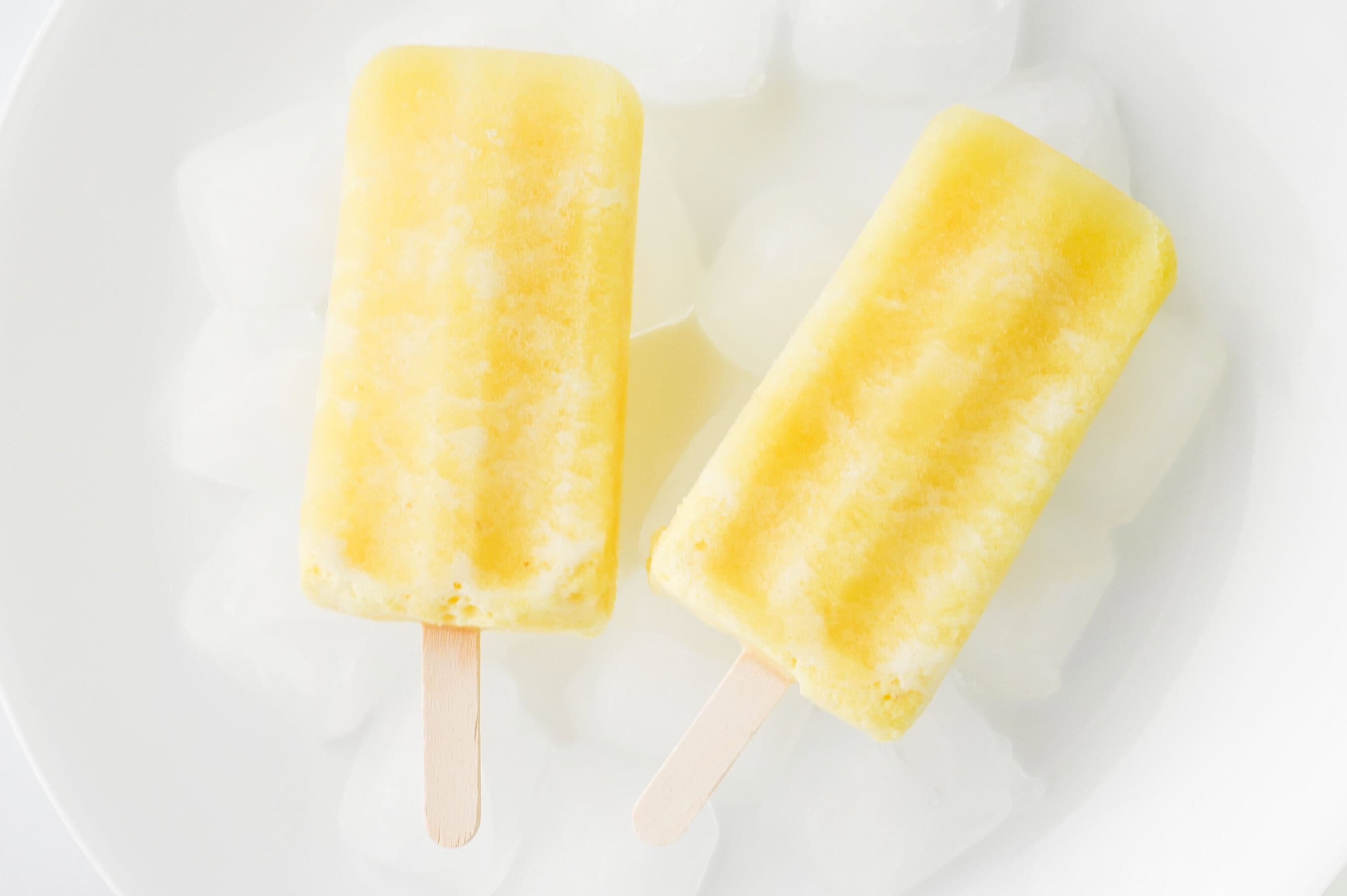 pina colada popsicles in a bowl of ice