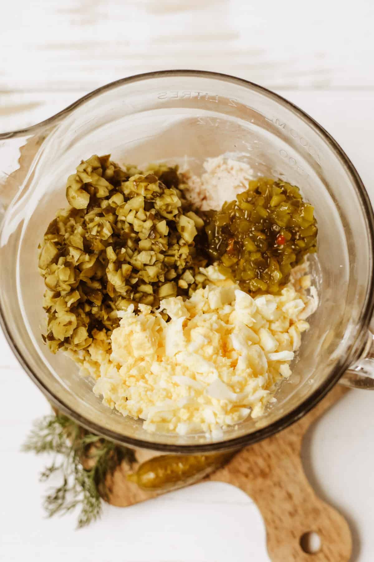 ingredients for dill pickle chicken salad in a bowl