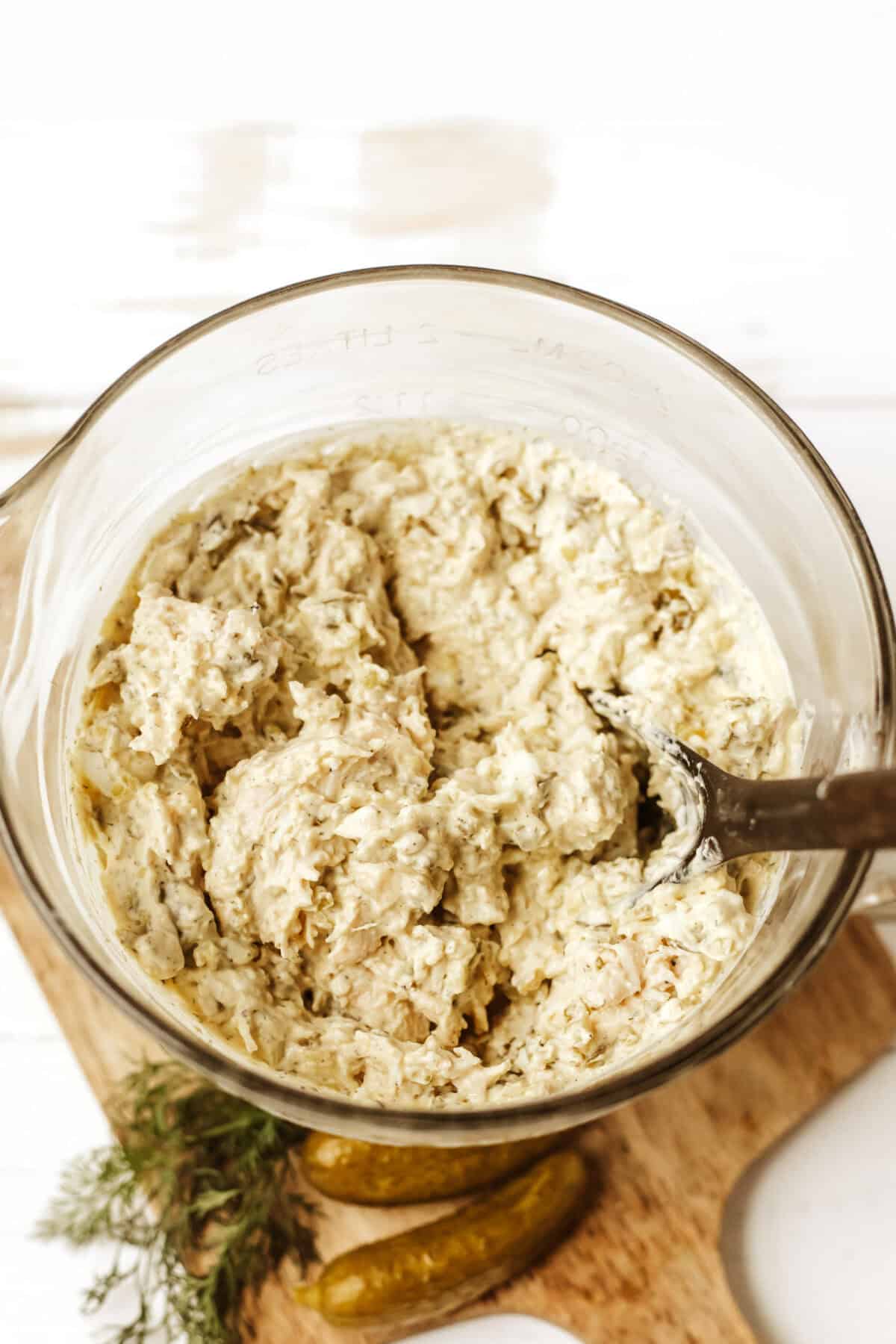 mixed up chicken salad in a clear bowl