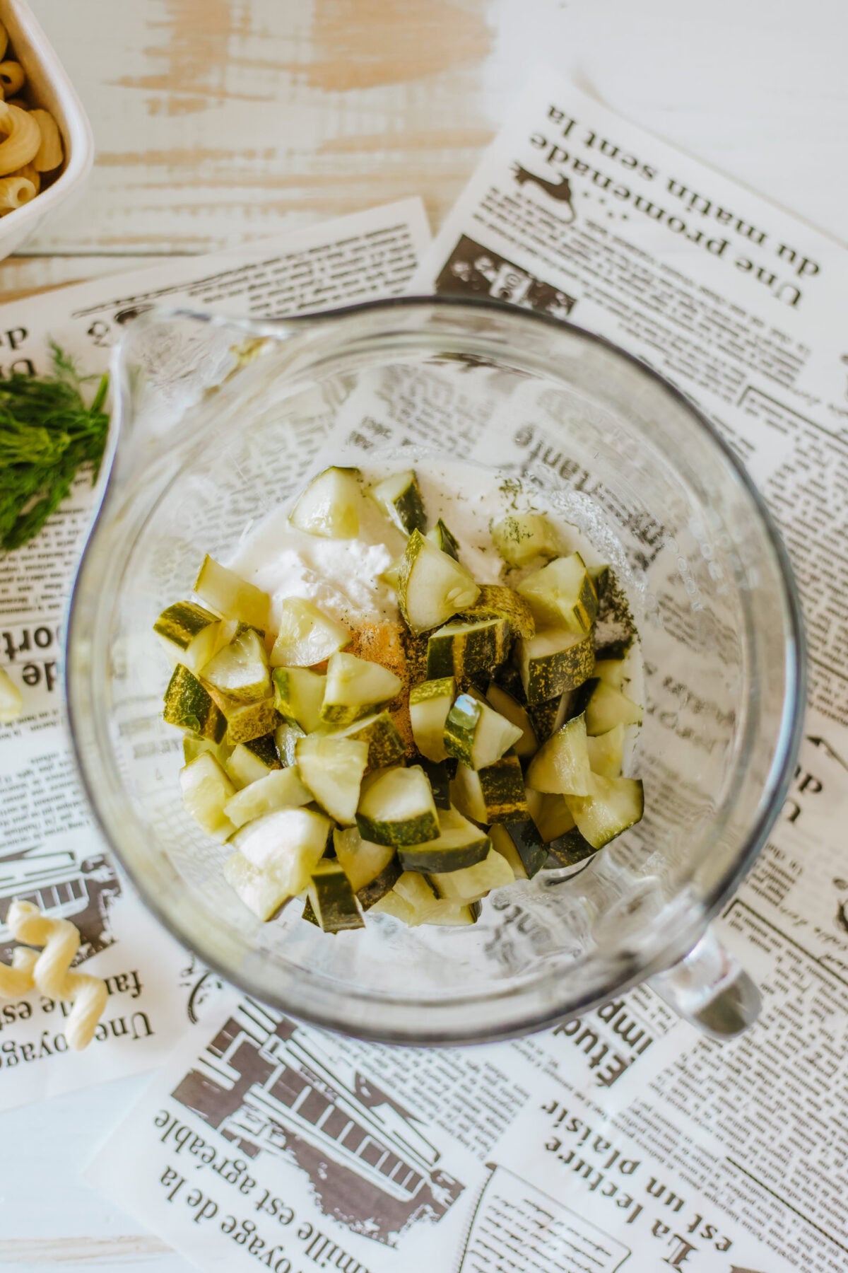 dill pickle pasta salad dressing ingredients in a mixing bowl