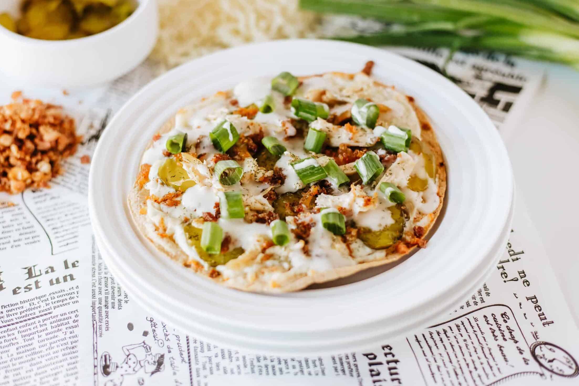 dill pickle pizza on a white plate