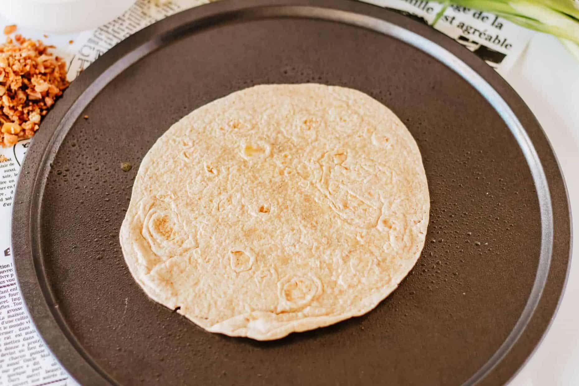 tortilla on a pizza pan