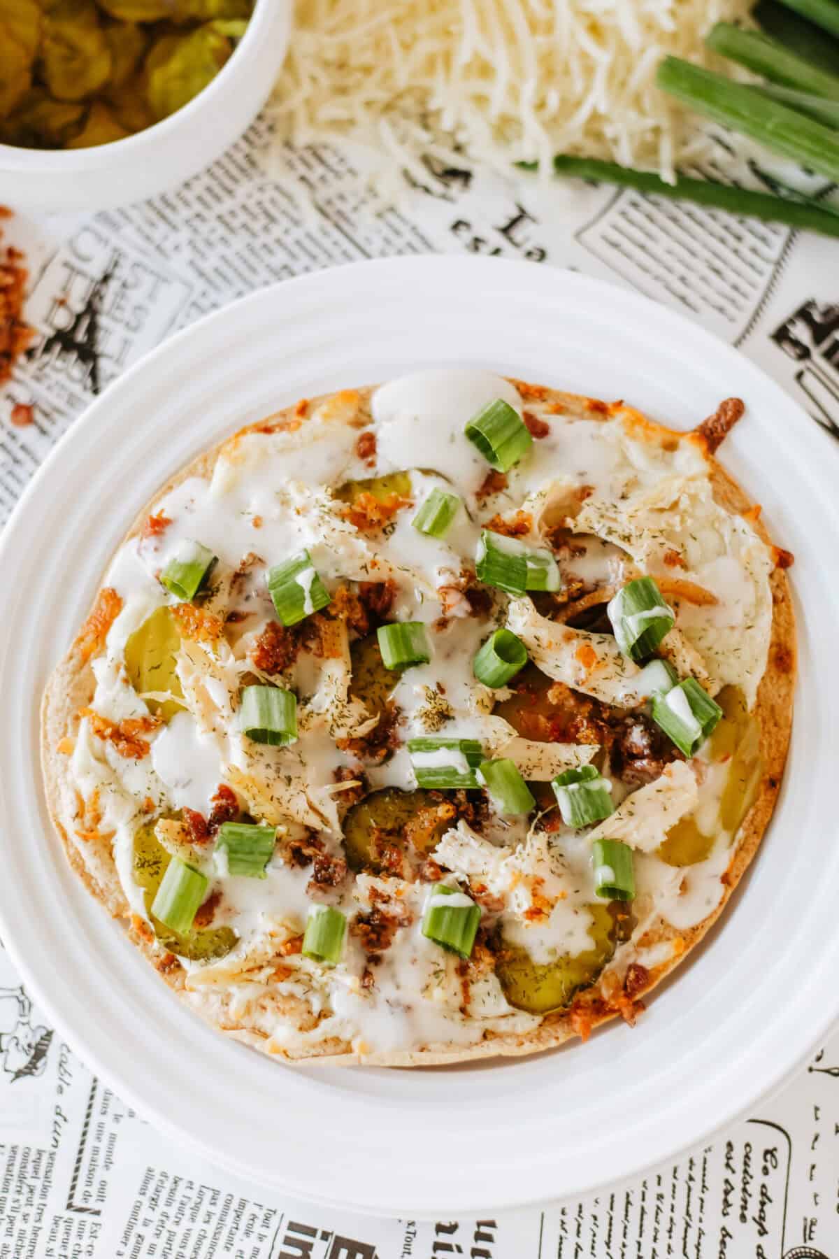 dill pickle pizza on a white plate