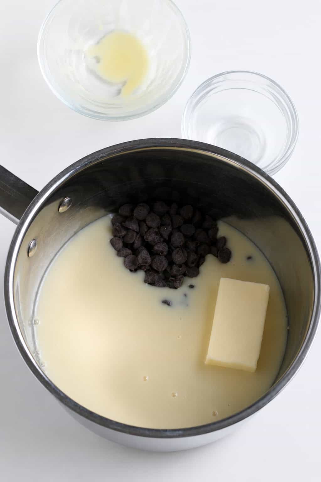 ingredients for hot fudge sauce in a saucepan