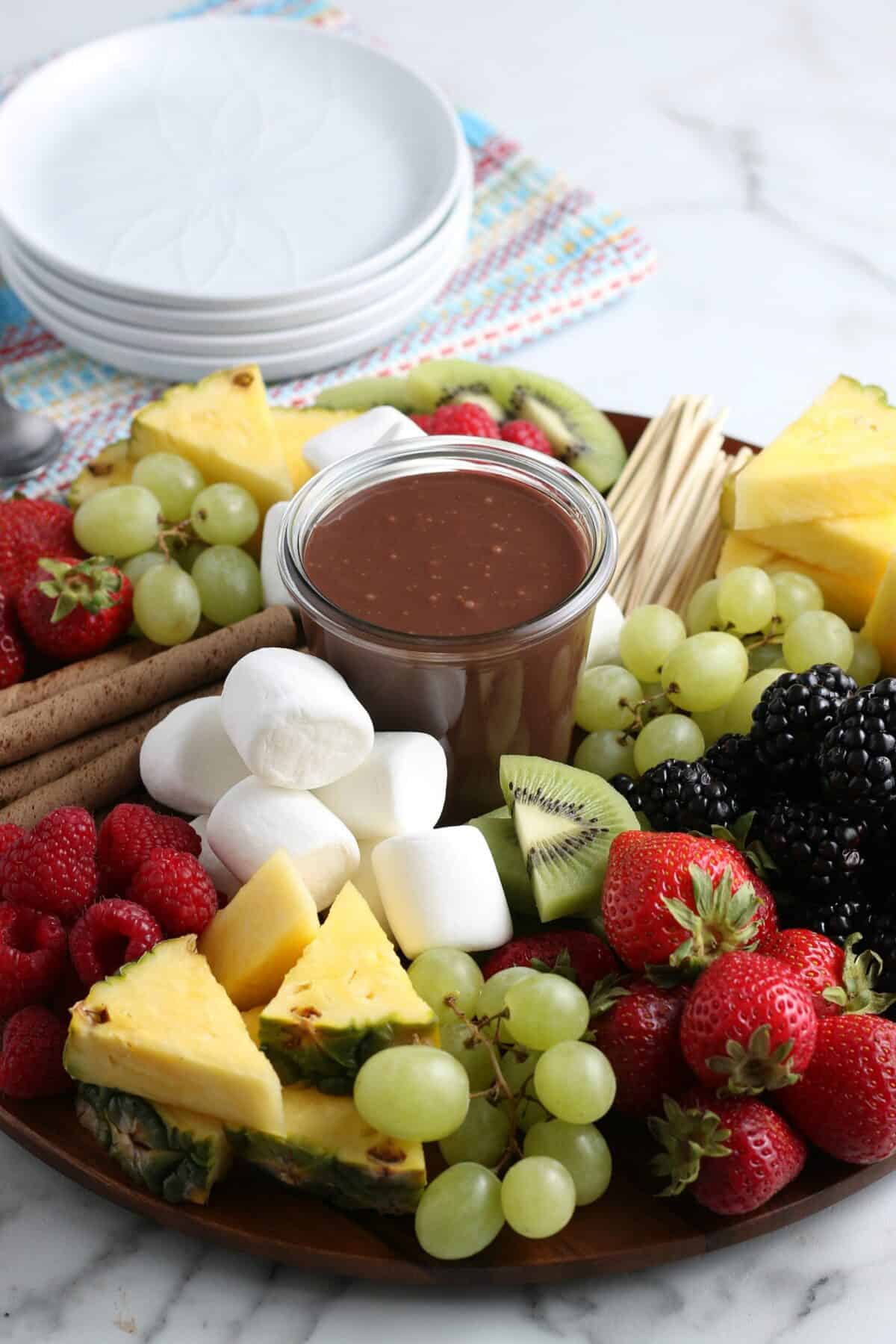 hot fudge sauce on a fresh fruit platter