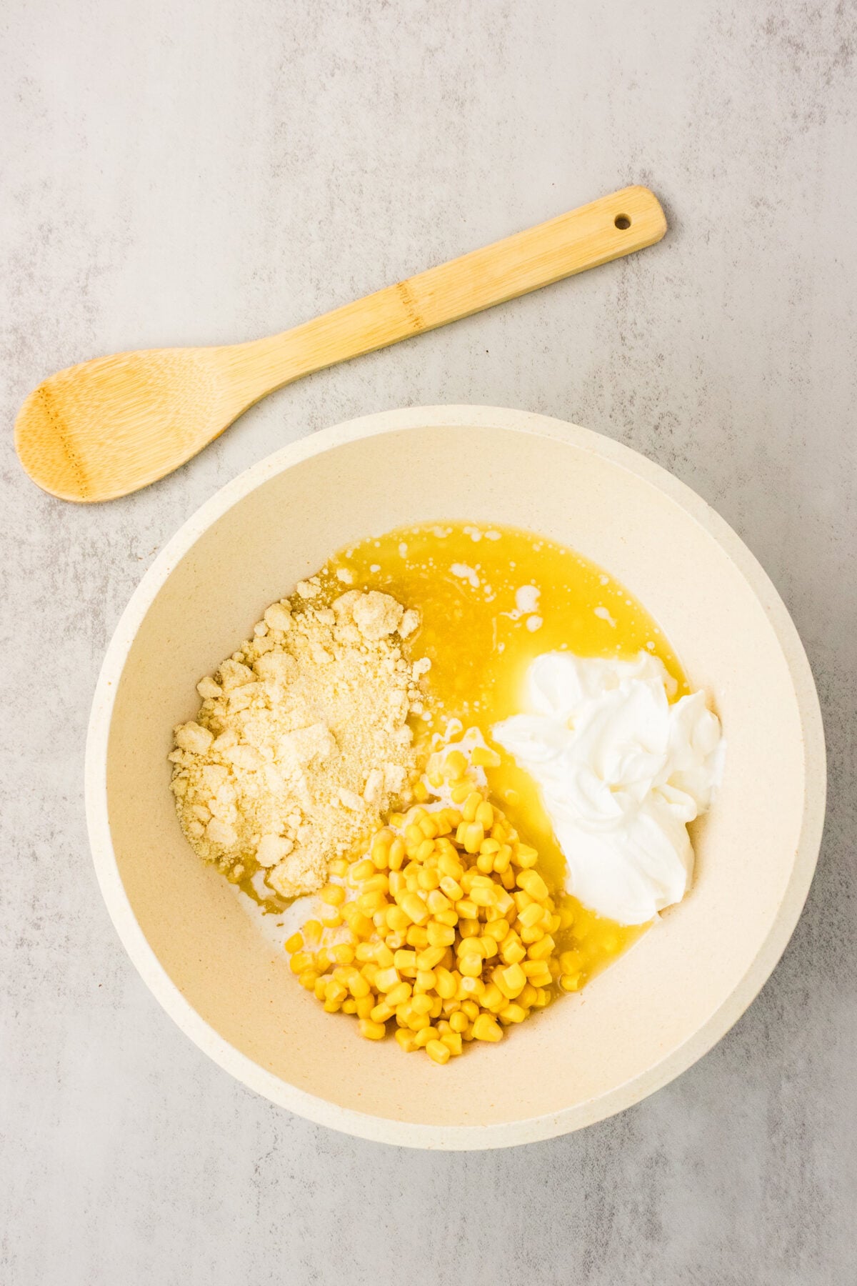 ingredients for Jiffy Corn Casserole in mixing bowl