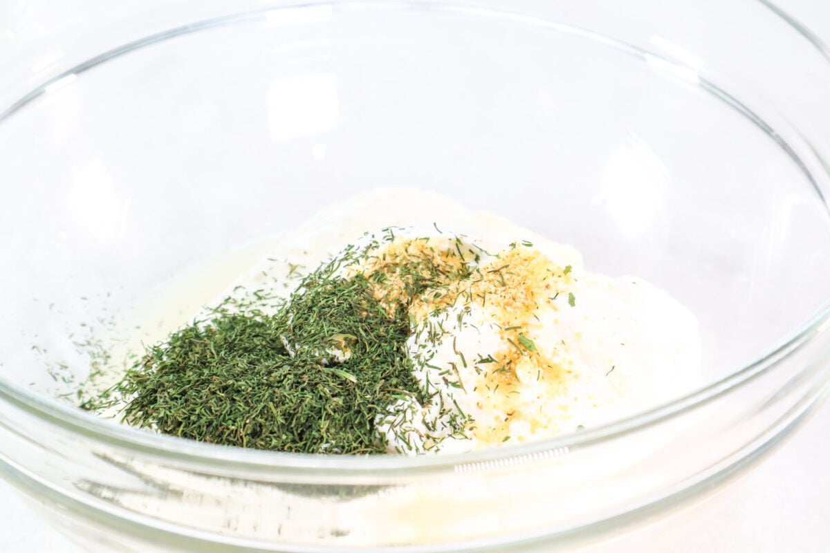 ingredients for dill pickle dip in a bowl