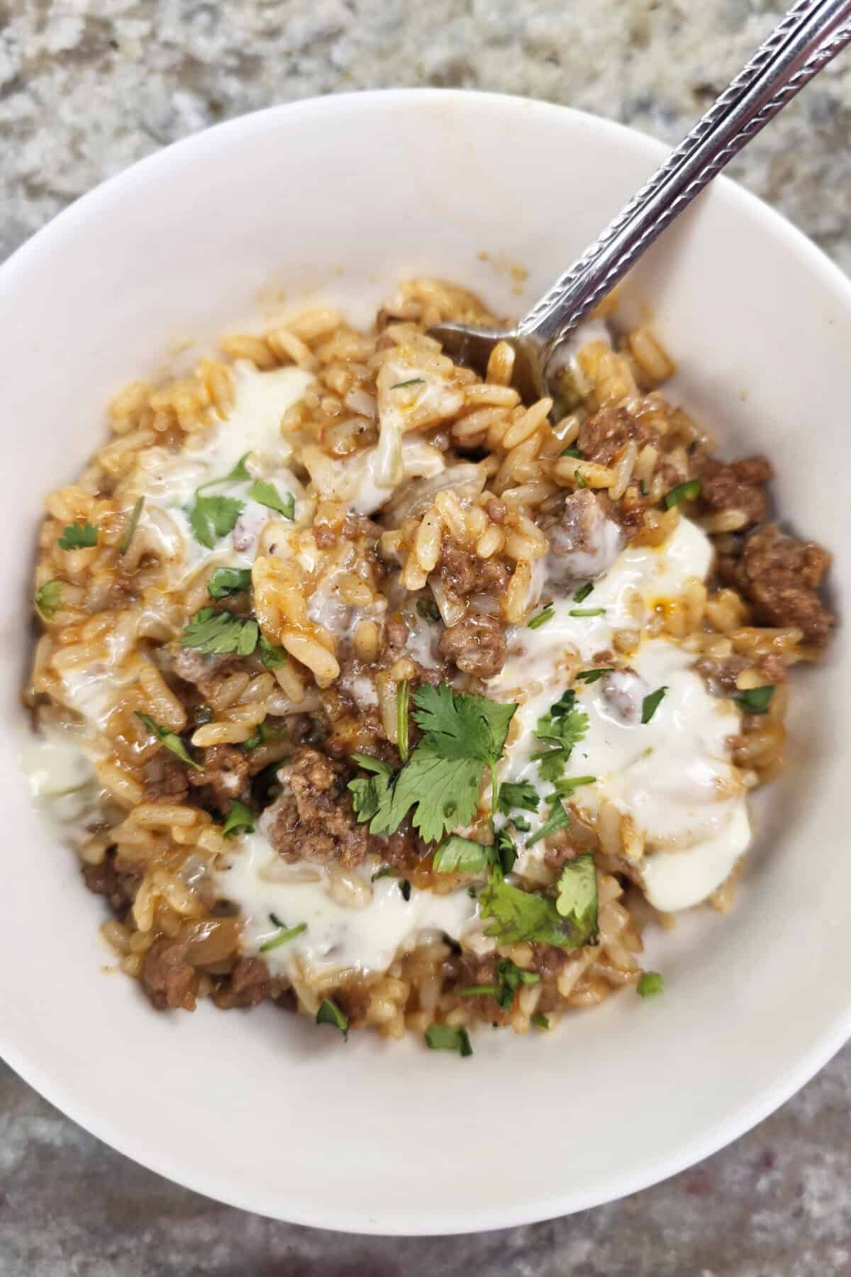 taco rice with queso and cilantro