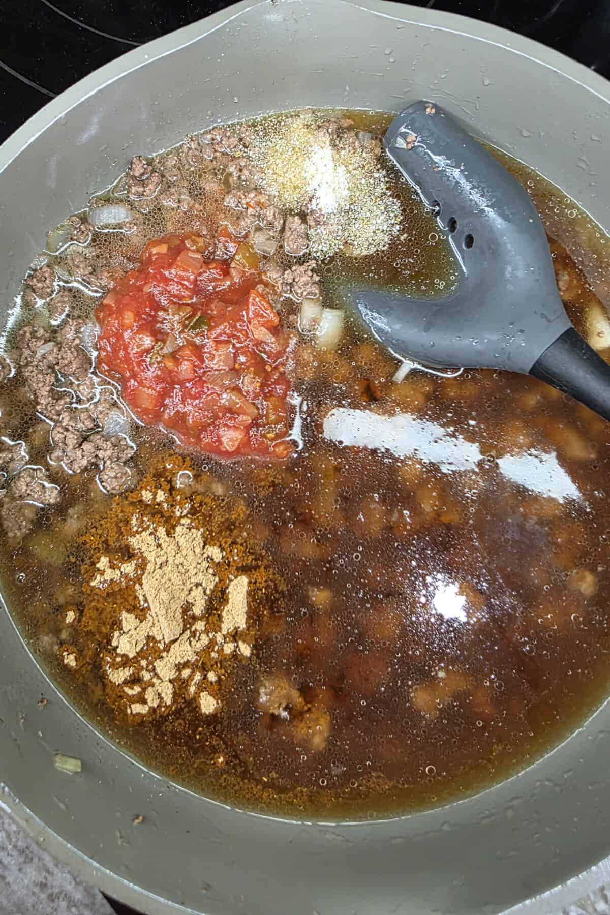 broth and seasonings added to cooked meat