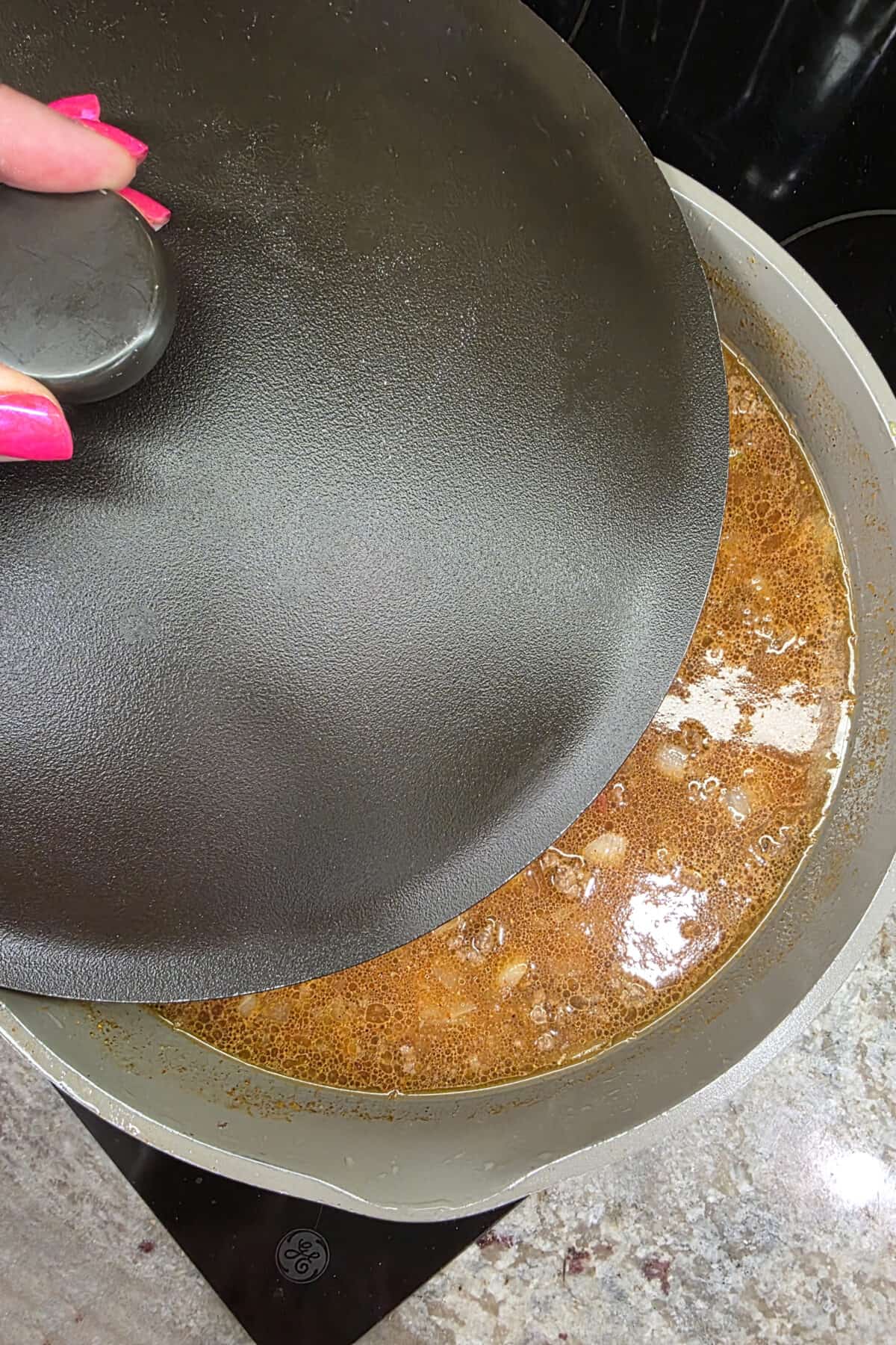 putting a lid on the skillet